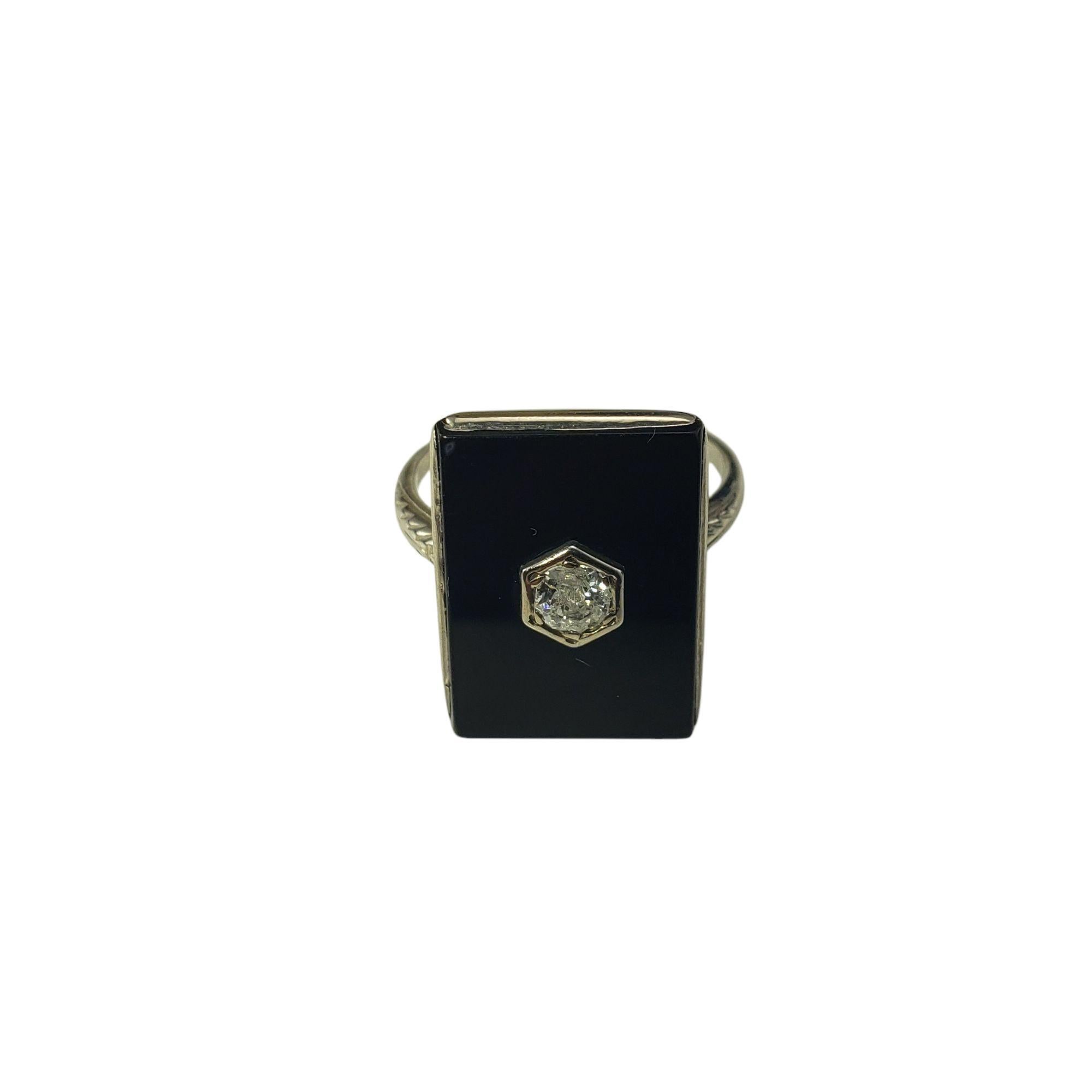 10 Karat White Gold Onyx and Diamond Ring Size 7.25

This elegant 10K white gold ring features a striking rectangular onyx stone accented with one round old mine cut diamond*, adding a touch of sparkle and luxury. 

Front of ring measures 19 mm x