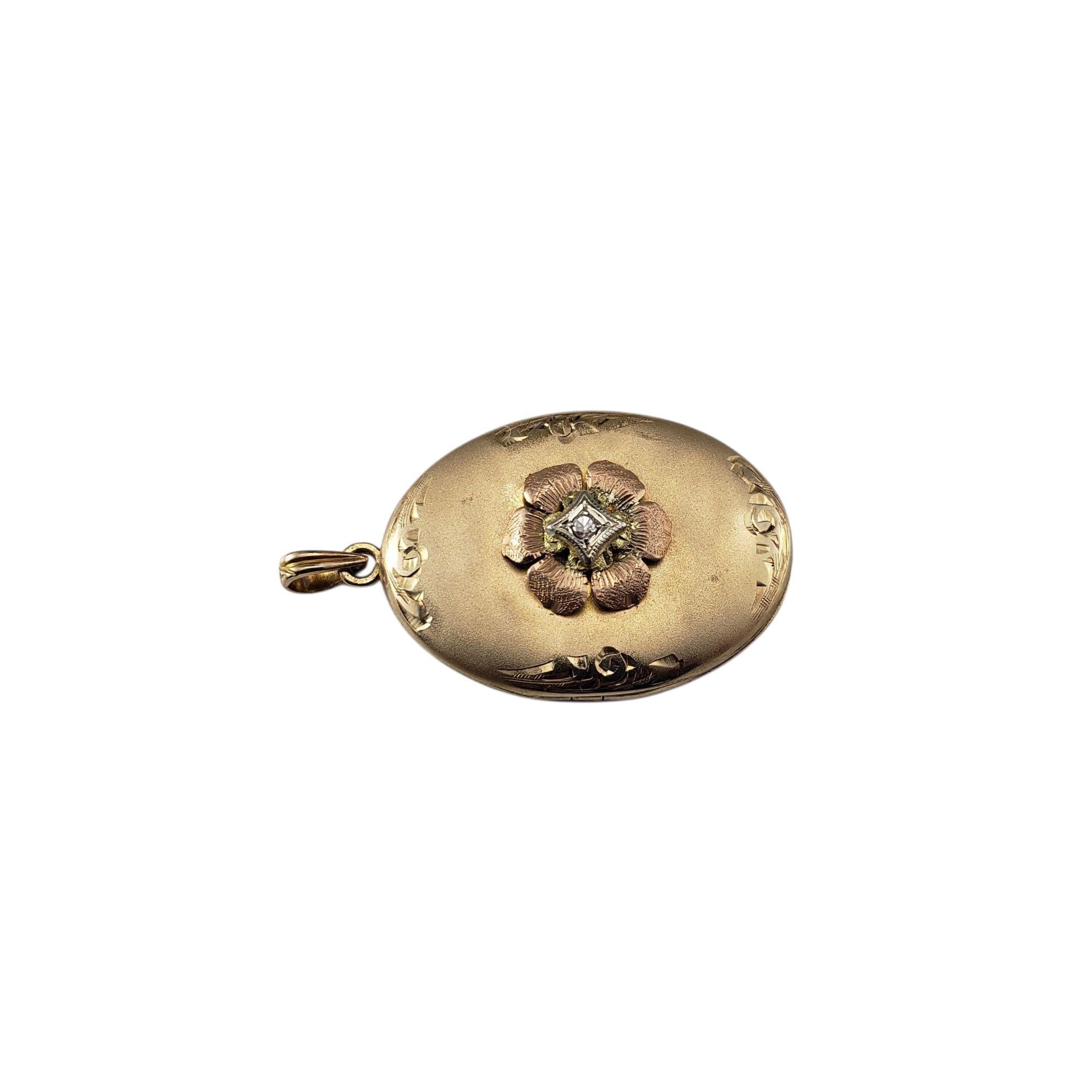 9 - 10 Karat Tricolor Gold and Diamond Floral Locket Pendant-

This charming 9 - 10K gold locket features delicate flower in rose gold that sits atop the yellow gold surface, accented by a sparkling single cut diamond set in white gold. The