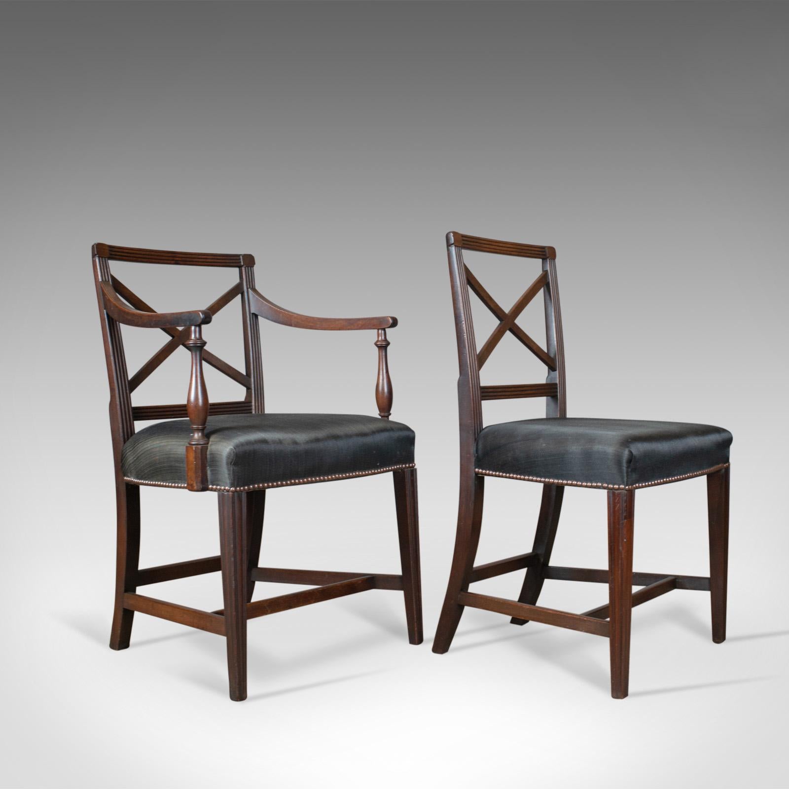 This is a set of nine antique dining chairs; A pair of carvers plus six sides and a spare. English Regency, mahogany chairs dating to the early 19th century, circa 1815. 

A fine set of chairs in select mahogany with a desirable patina
Good