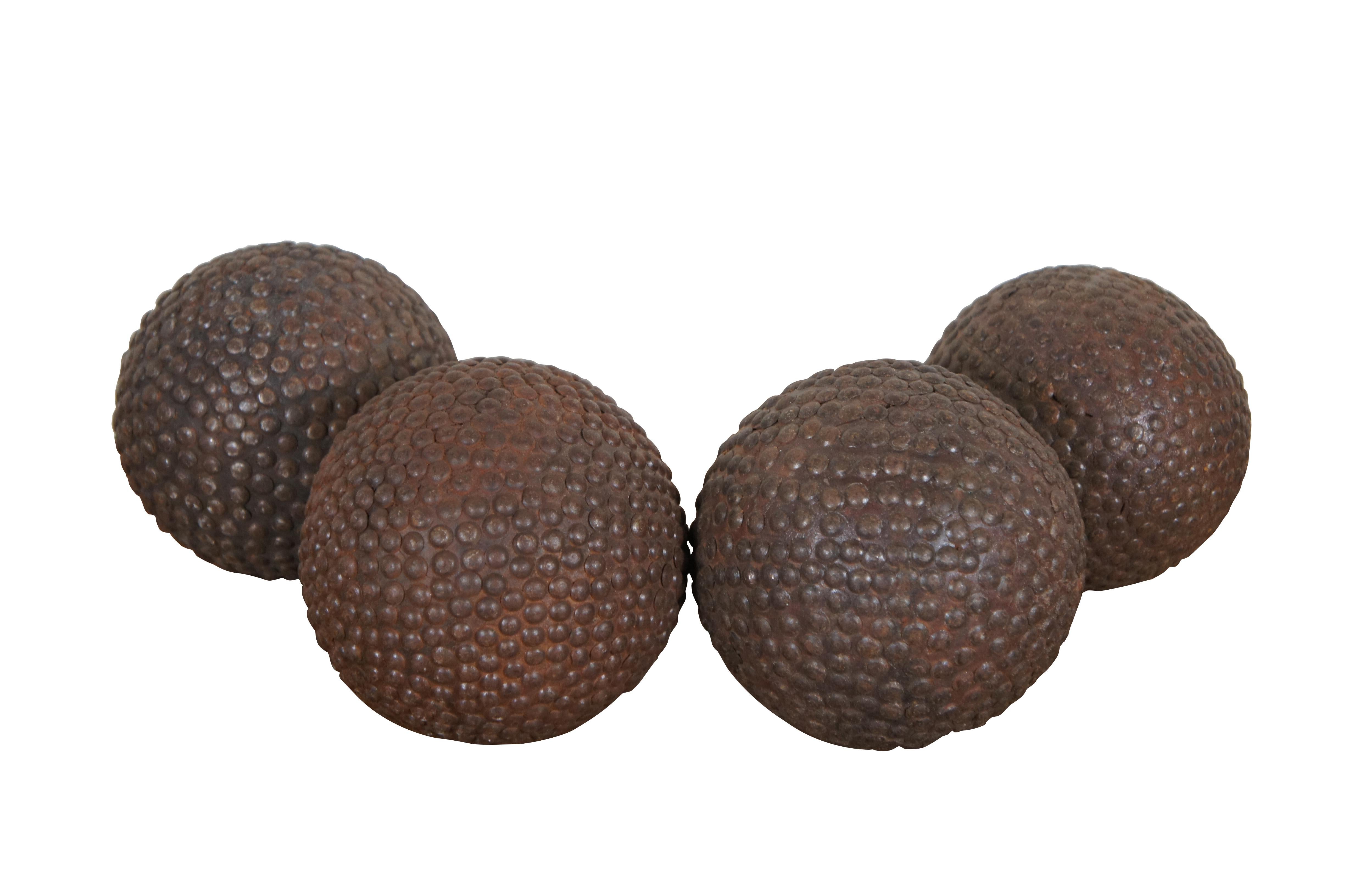 Set of 9 antique French bowling game/boules cloutees / nailed balls - spheres of wood studded throughout with nails for durability. Four large, five small.  

Dimensions:
Large - 4.5