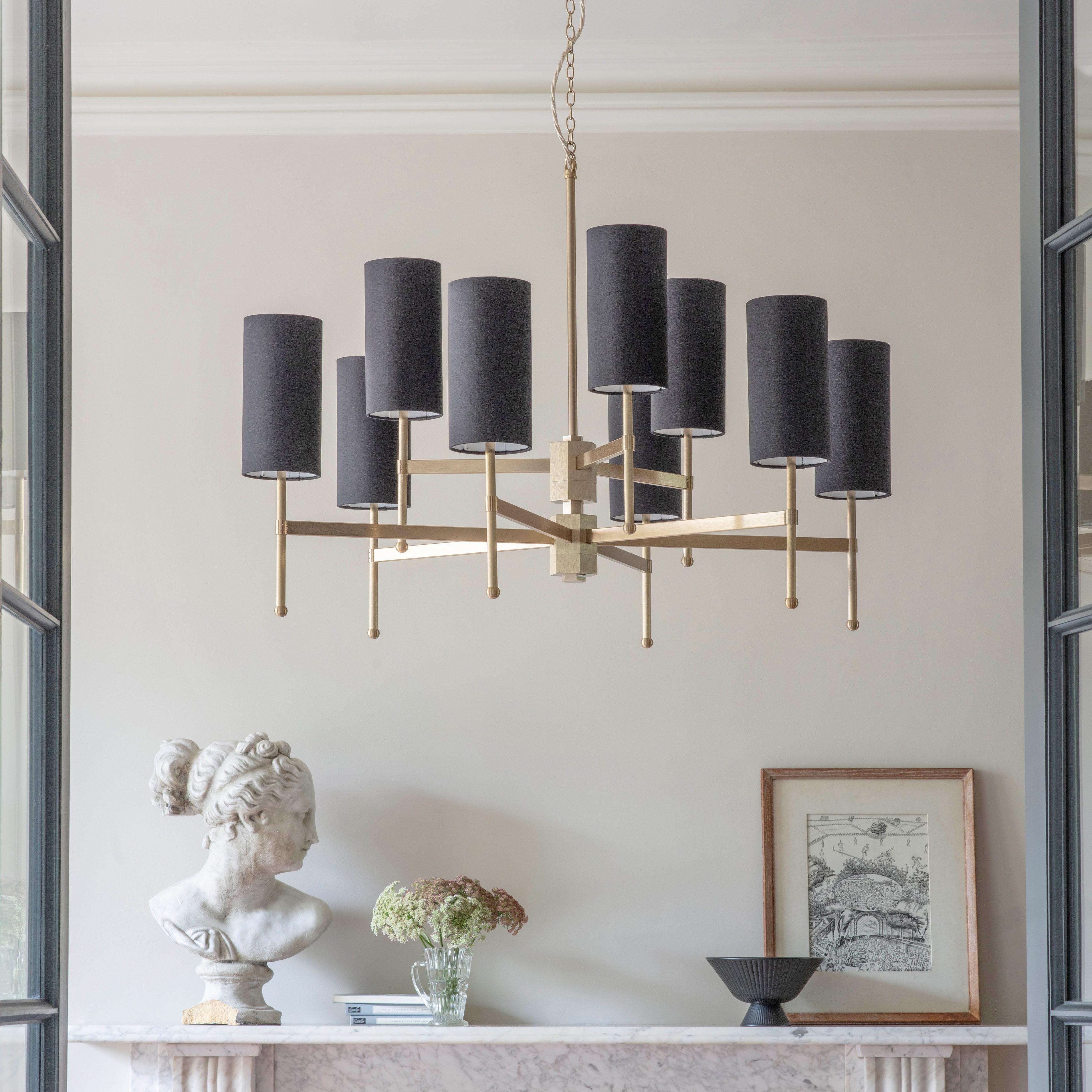 An elegant midcentury chandelier featuring a handcrafted metal stem frame, supporting beautiful silk douppion shades. The hand-grained Bronze metalwork is perfectly balanced by the richness of silk shades. 

Designed and handmade by Tigermoth