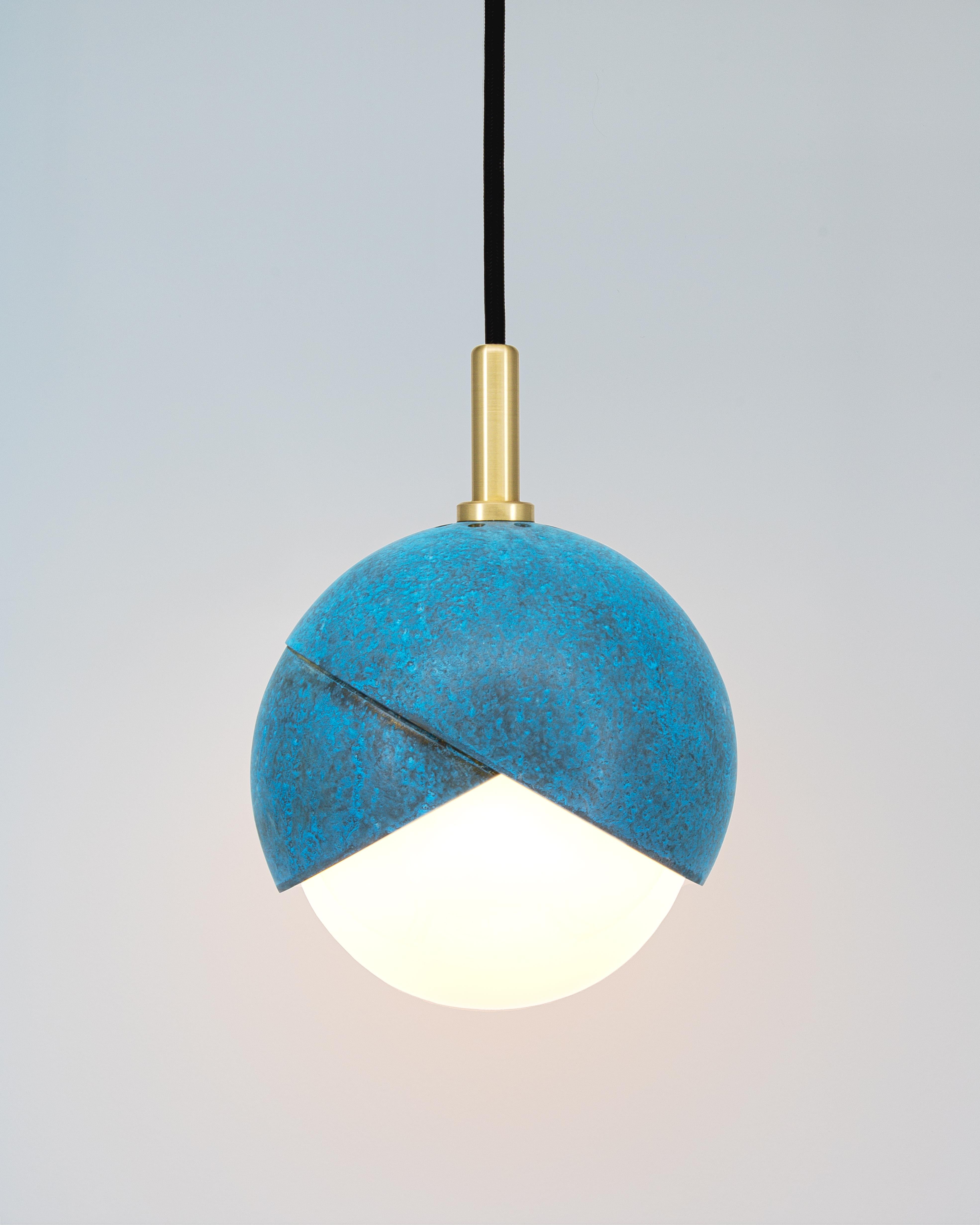 The Benedict™ Pendant light celebrates the defining detail of the Benedict™ Series. Two nested spun brass hemispheres cradle a hand blown glass globe. This light fixture lends itself to creative configuration of our many finishes meaning it’s sure