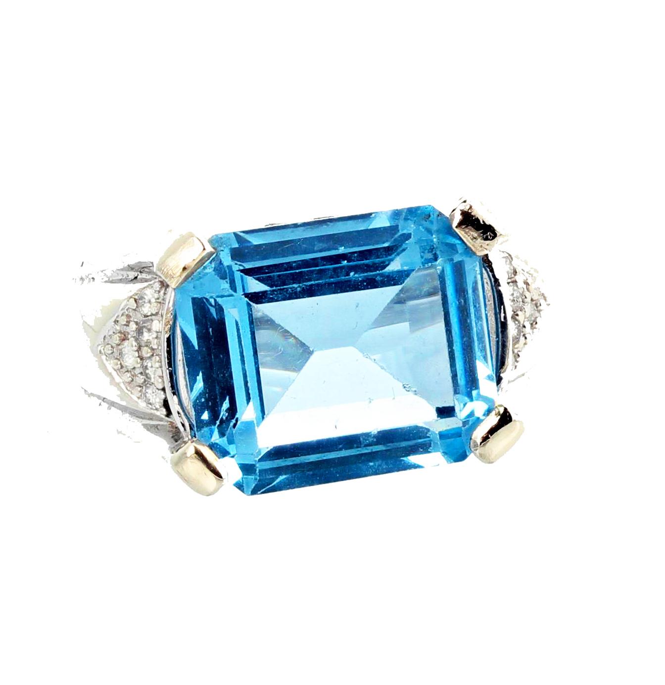 Glittering brilliant emerald cut huge Brasilian 9 Carat blue Topaz - 14.2 mm x 12 mm - enhanced with teeny tiny sparkling little Diamonds in this 10 Kt white gold ring size 7 sizable FOR FREE.  This is wonderful for day to evening fun.  