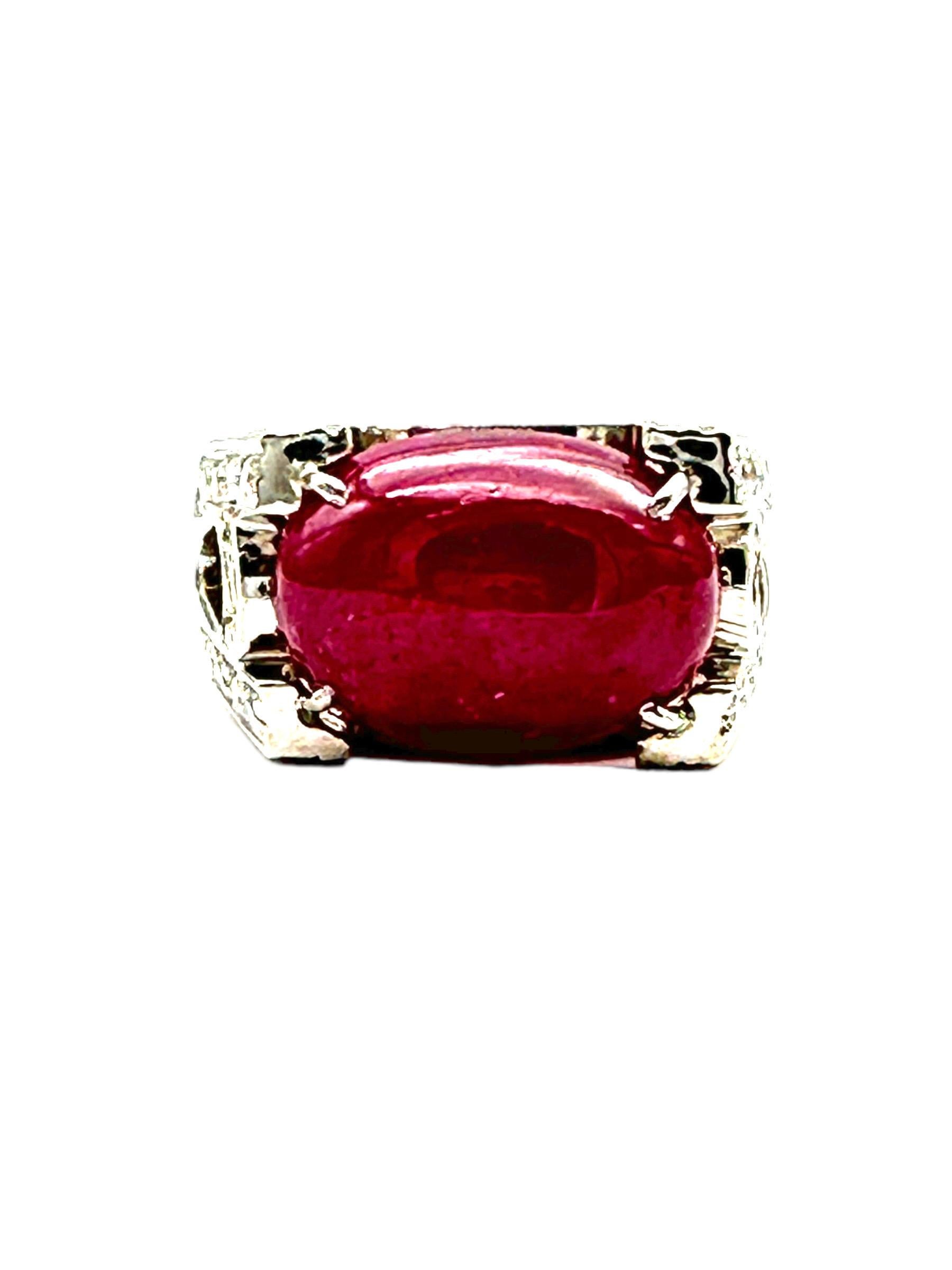 One 14-karat white gold ring consisting of Fifty-two round brilliant diamonds is set in a wide 11.50 mm ring featuring a center red ruby gemstone.This ruby pave set diamond ring makes a stunning statement with its nearly, 1.50 ct of shining