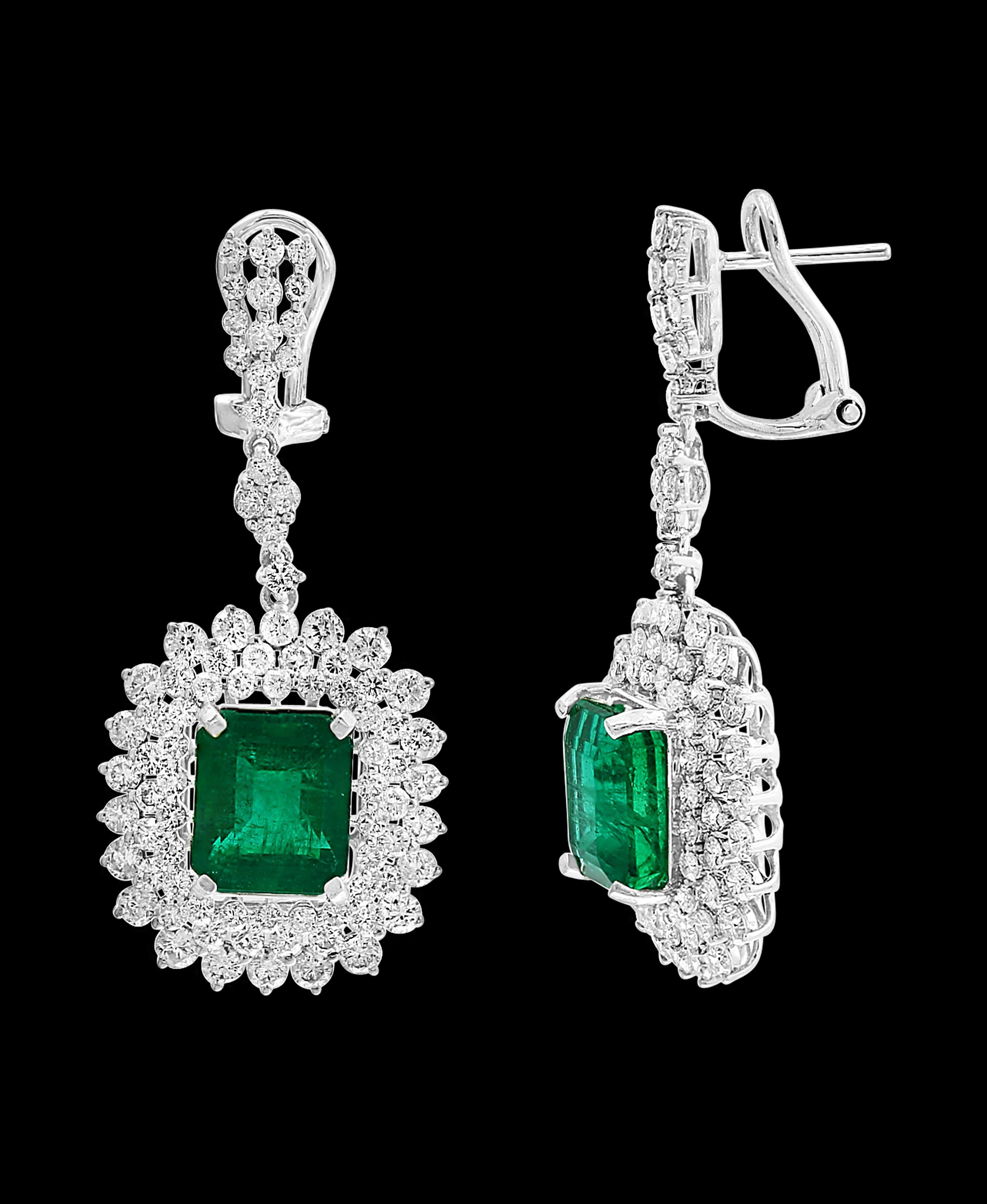 9 Carat Colombian Emerald Cut Emerald Diamond  Hanging Earrings 18 K White Gold
This exquisite pair of earrings are beautifully crafted with 18 karat White gold  weighing   9 grams
Two fine Natural  Colombian  Emerald  Cut Emeralds weighing