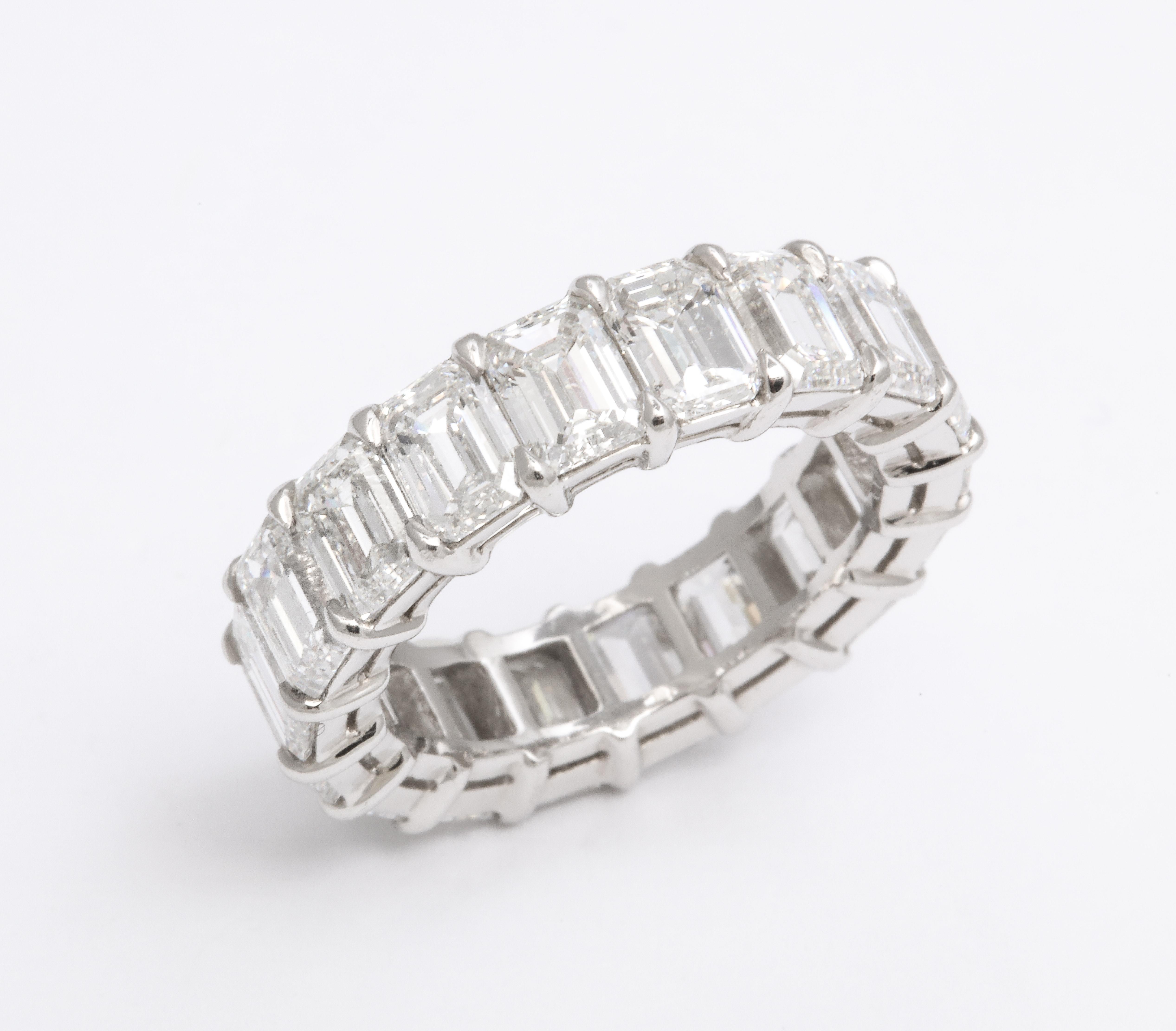 
An impressive and wearable diamond band.

9.01 carats of white Emerald cut diamonds set in a custom platinum mounting. 

6 mm wide

Size 6.5, the size can be adjusted slightly. 