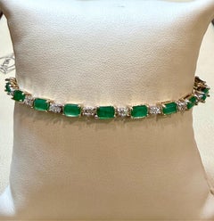 9 Carat Emerald Cut Emerald and Diamond Tennis Bracelet 14 Karat Yellow Gold