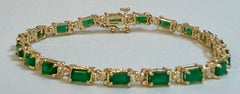 9 Carat Emerald Cut Emerald and Diamond Tennis Bracelet 14 Karat Yellow Gold