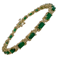 9 Carat Emerald Cut Emerald and Diamond Tennis Bracelet 14 Karat Yellow Gold