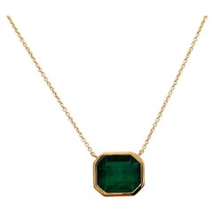 9 Carat Emerald Octagonal East West Bezel Necklace in 18K Yellow Gold