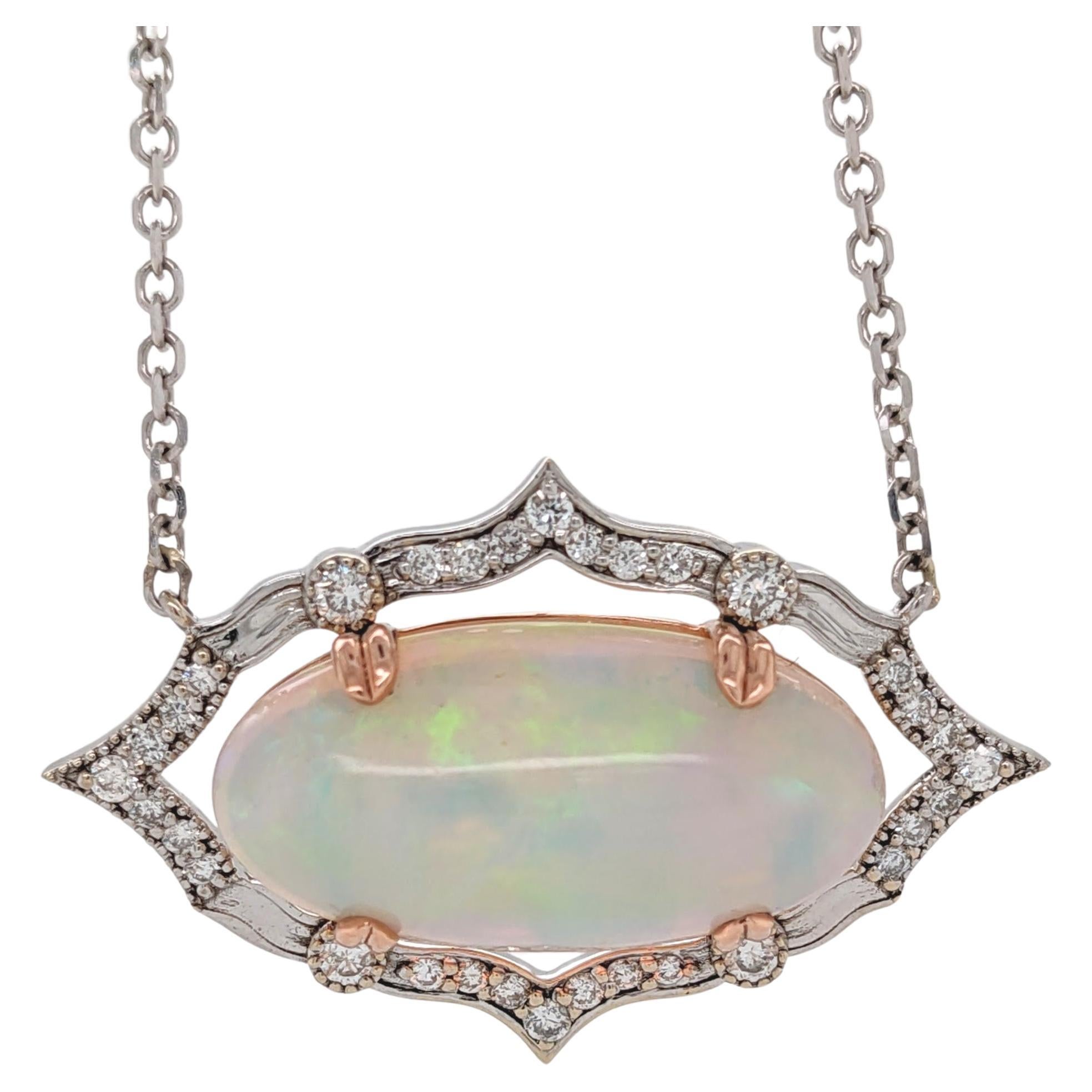 9 Carat Ethiopian Opal East West Pendant in 14K Dual Tone Gold with Diamond Halo For Sale