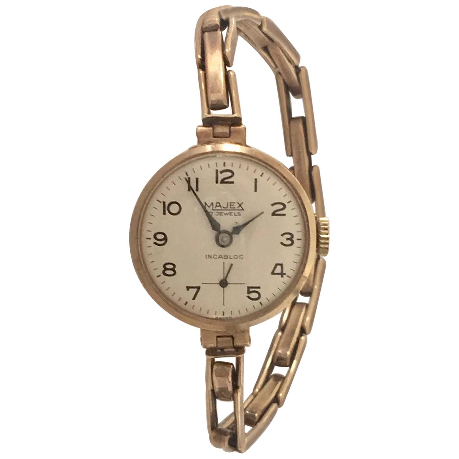 9 Carat Gold Ladies Swiss Made Wristwatch on a 9 Carat Gold London Made Strap For Sale