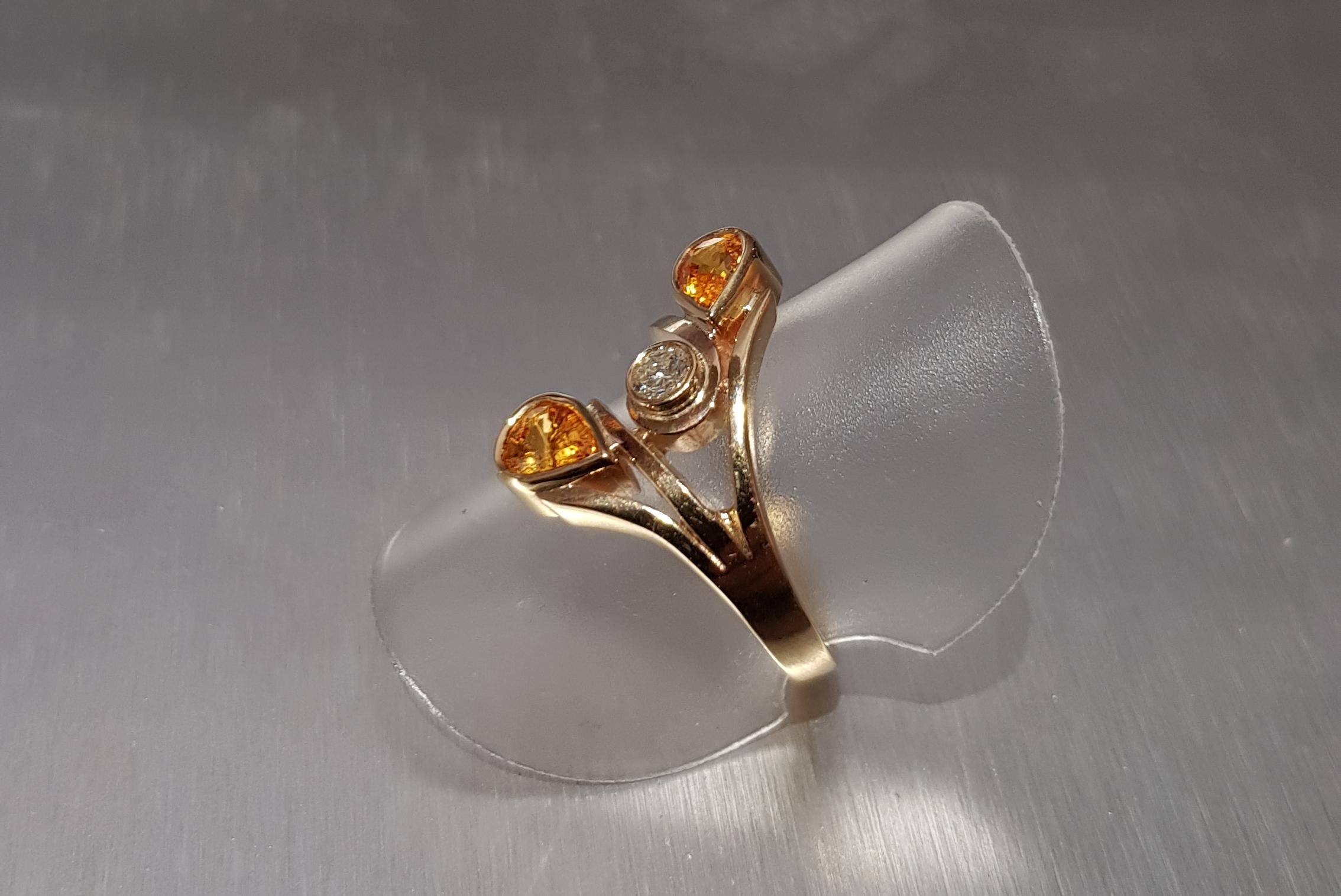 Unusual and beautiful light Orange Sapphires with a Diamond in spray style dress ring hand made in 9ct Gold.
ring size N

AVAILABLE