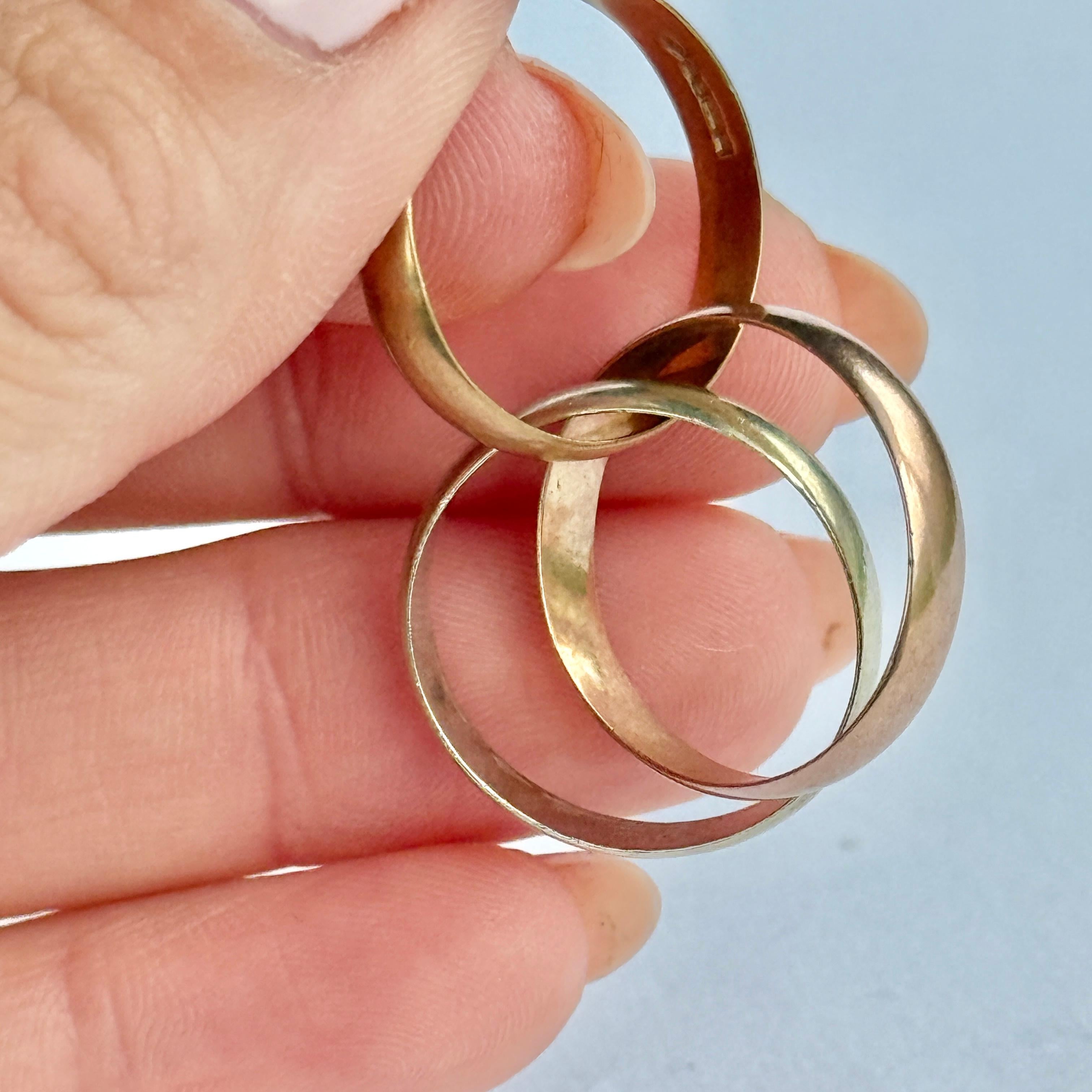 This triple band is made up of a white gold, yellow gold and rose gold band. Hallmarked Sheffield 1990 and modelled in 9ct gold. 

Ring Size: J 1/2 or 5
Individual Band Width: 4mm

Weight: 5.2g