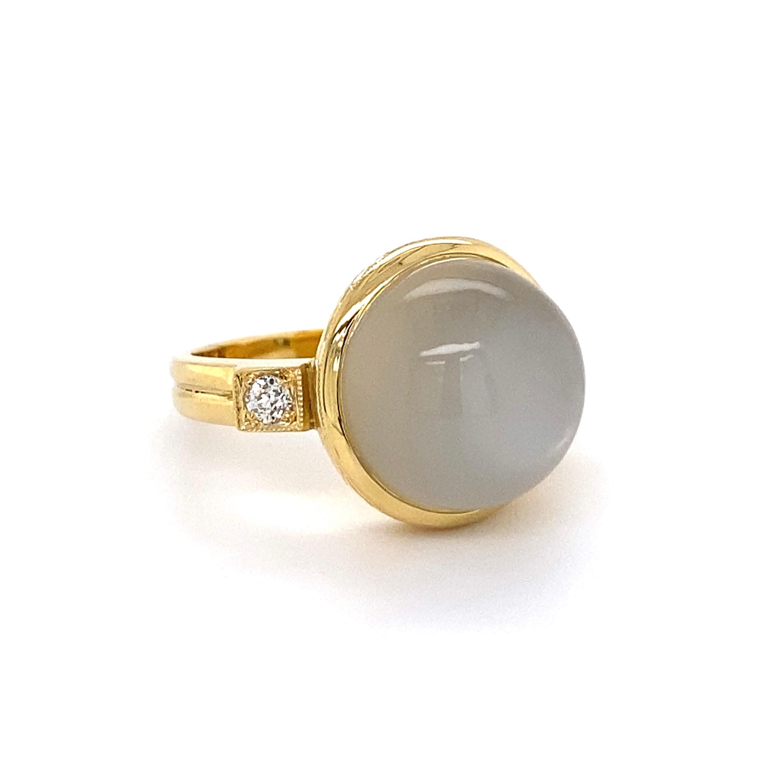 Simply Beautiful! Finely detailed Large Moonstone and Diamond Cocktail Ring. Centering a securely Hand set Cabochon Moonstone, weighing approx. 9 Carats, accented by Old European-Cut Diamonds, approx. 0.22 total carat weight. Hand crafted 18K Yellow