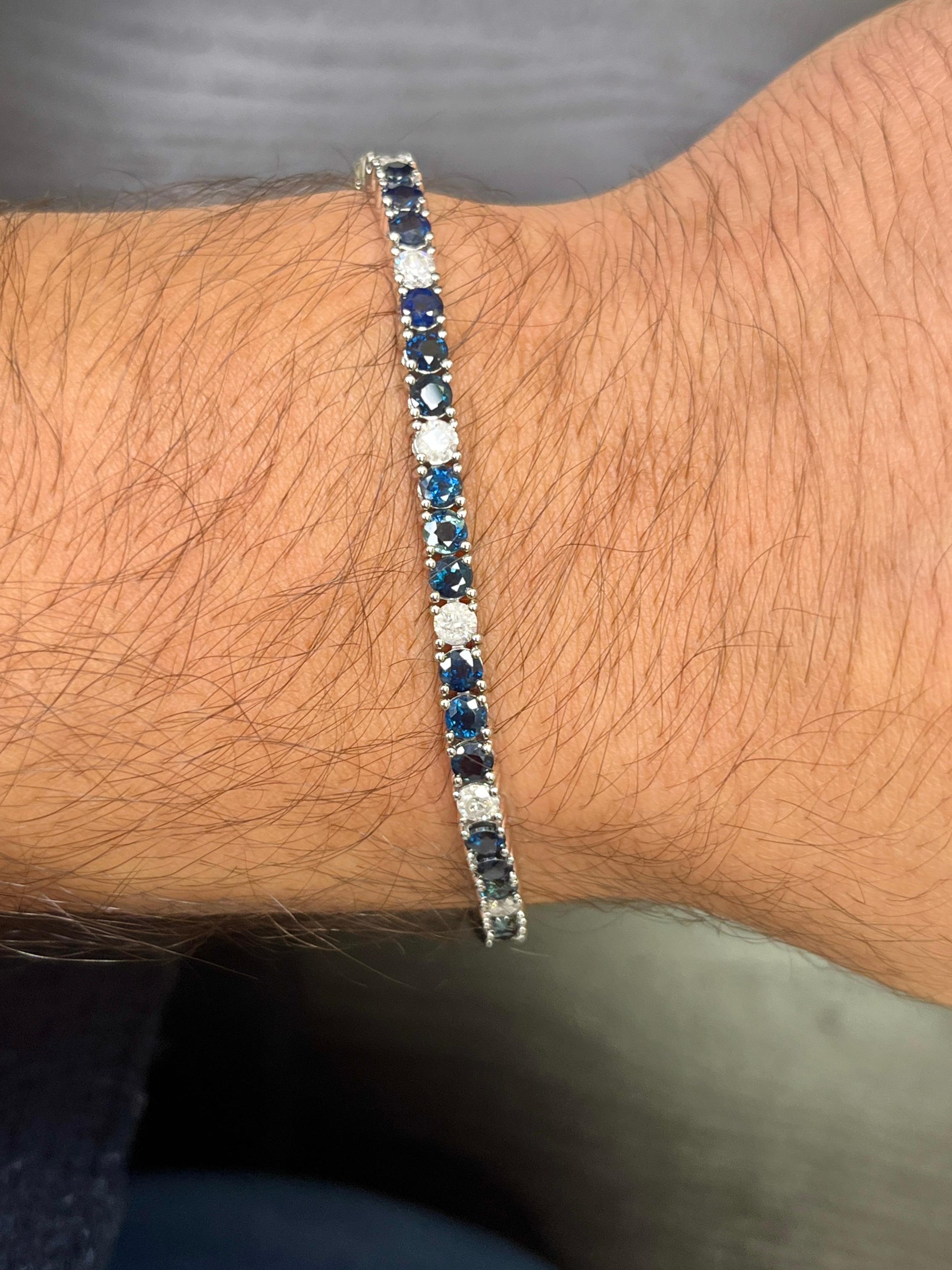 9.26 Carat Round Cut Natural Blue Sapphire and Diamond Tennis Bracelet in 18K White Gold.

This tennis bracelet features a stunning collection of round-cut blue sapphires totaling 7.58 carats. The sapphires are matched with thirteen alternating