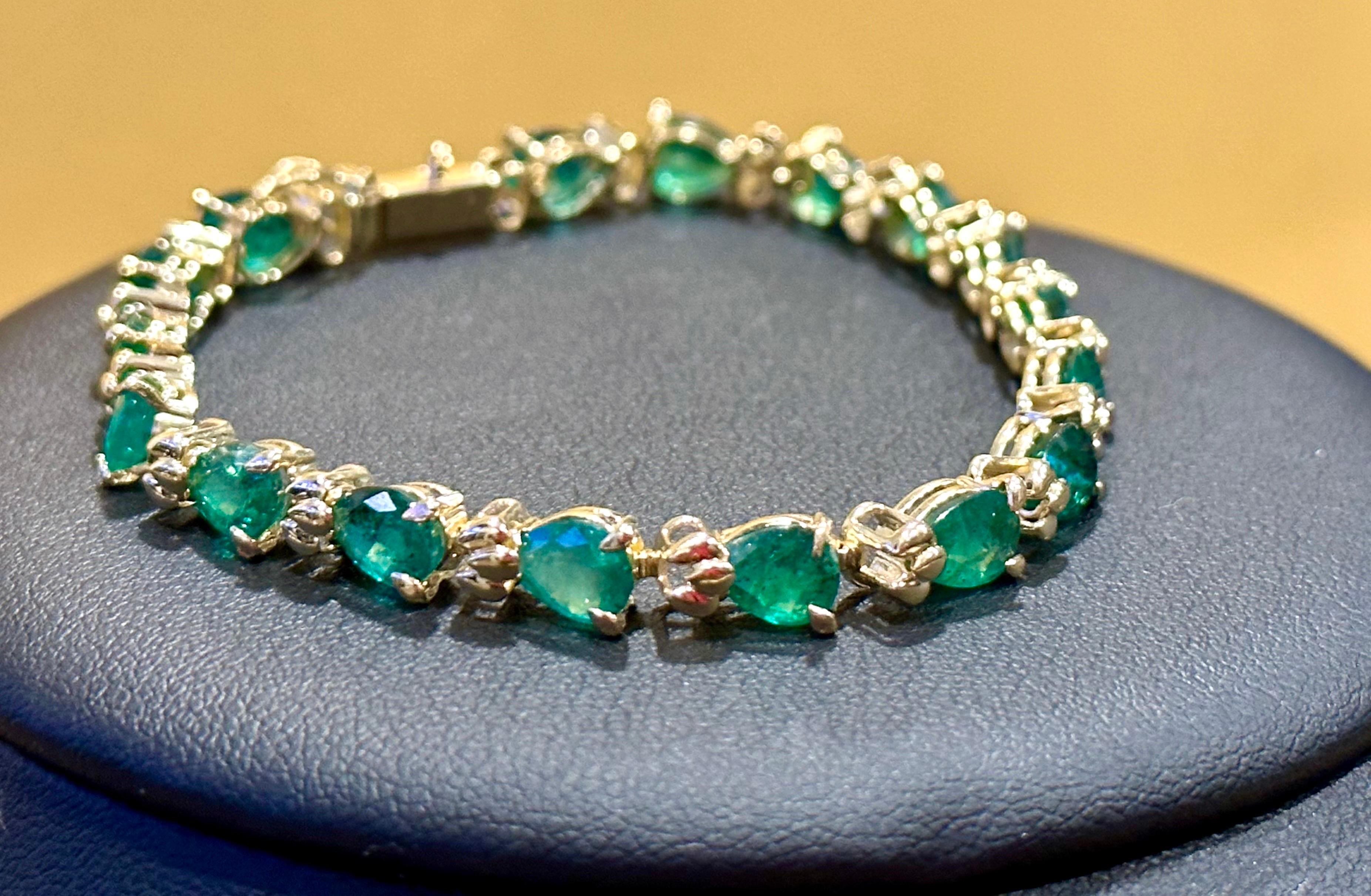  This exceptionally affordable Tennis  bracelet has  17 stones of Pear shape  Emeralds  . Each Emerald is spaced by a small gold design . Total weight of the Emeralds is  approximately 9 carat. 
The bracelet is expertly crafted with 10 grams of  14