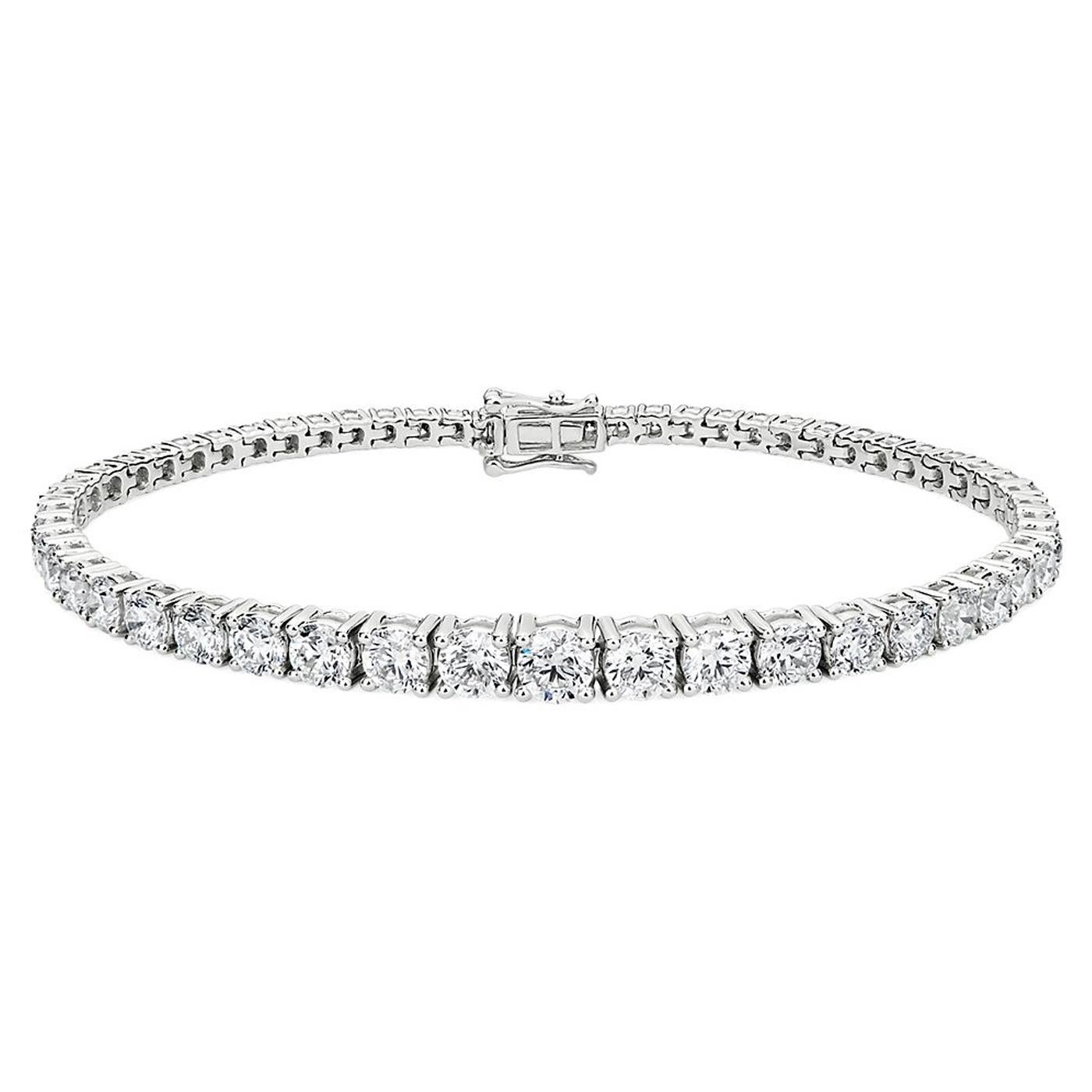 The elegance of this stunning 18K white gold tennis bracelet features round-cut diamonds placed in a 4-prong setting for a sturdy and balanced look that's sure to catch the eye. Classic style & intricate workmanship makes this bracelet a true
