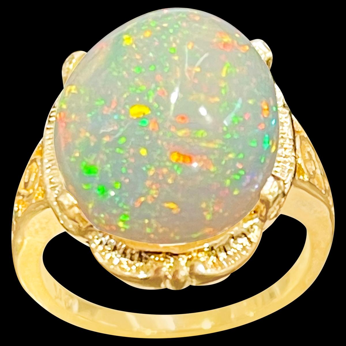 approximately 9 Carat Oval Shape Ethiopian Opal Cocktail Ring 14 Karat Yellow Gold size 5.5
Oval  Natural Opal  A classic, Cocktail ring 
14 Karat Yellow Gold Estate
Size of the opal 16 X 13 MM, Approximately 9 Ct
Amazing colors in this opal and a