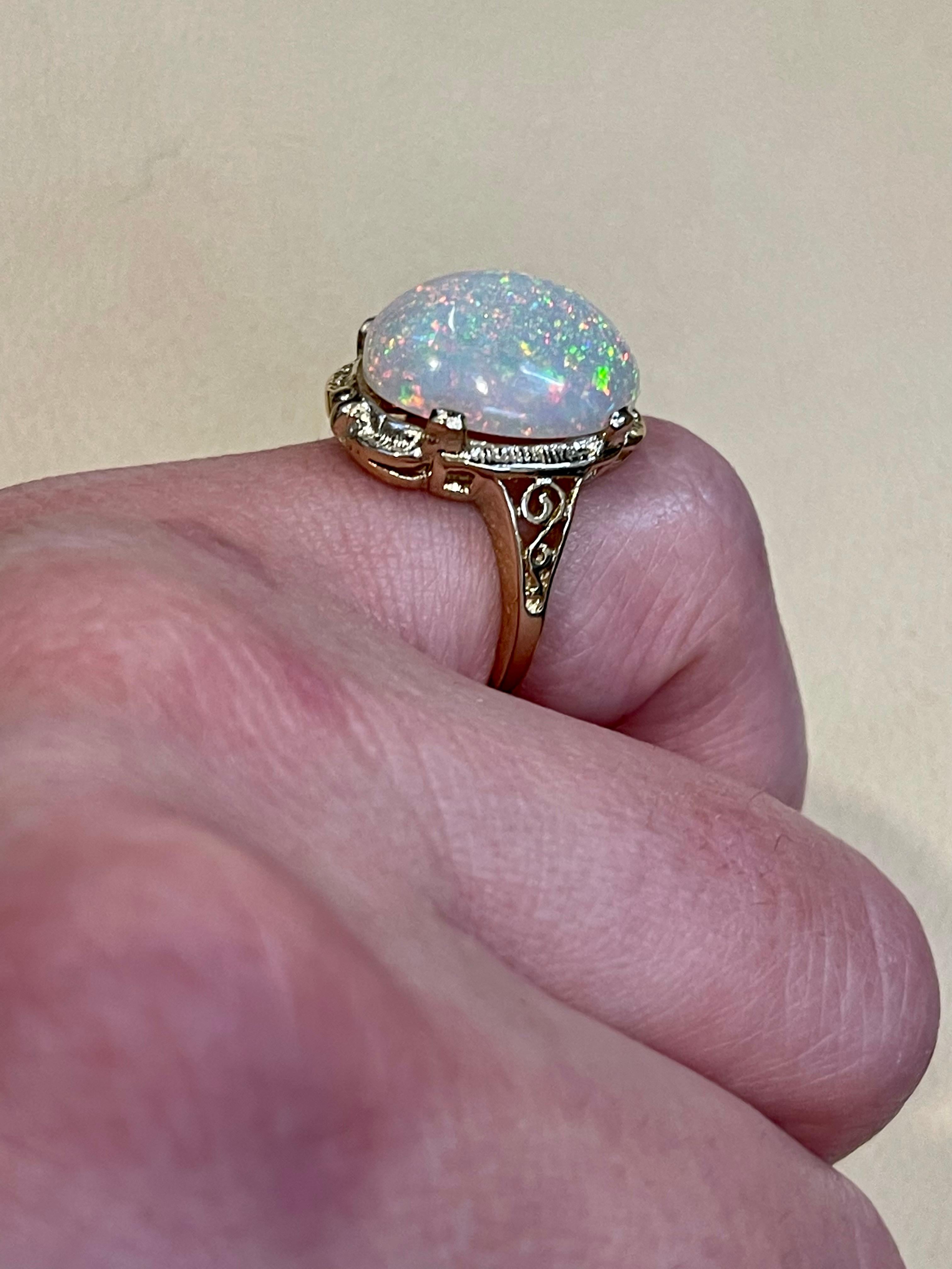 Oval Cut 9 Carat Oval Shape Ethiopian Opal Cocktail Ring 14 Karat Yellow Gold For Sale