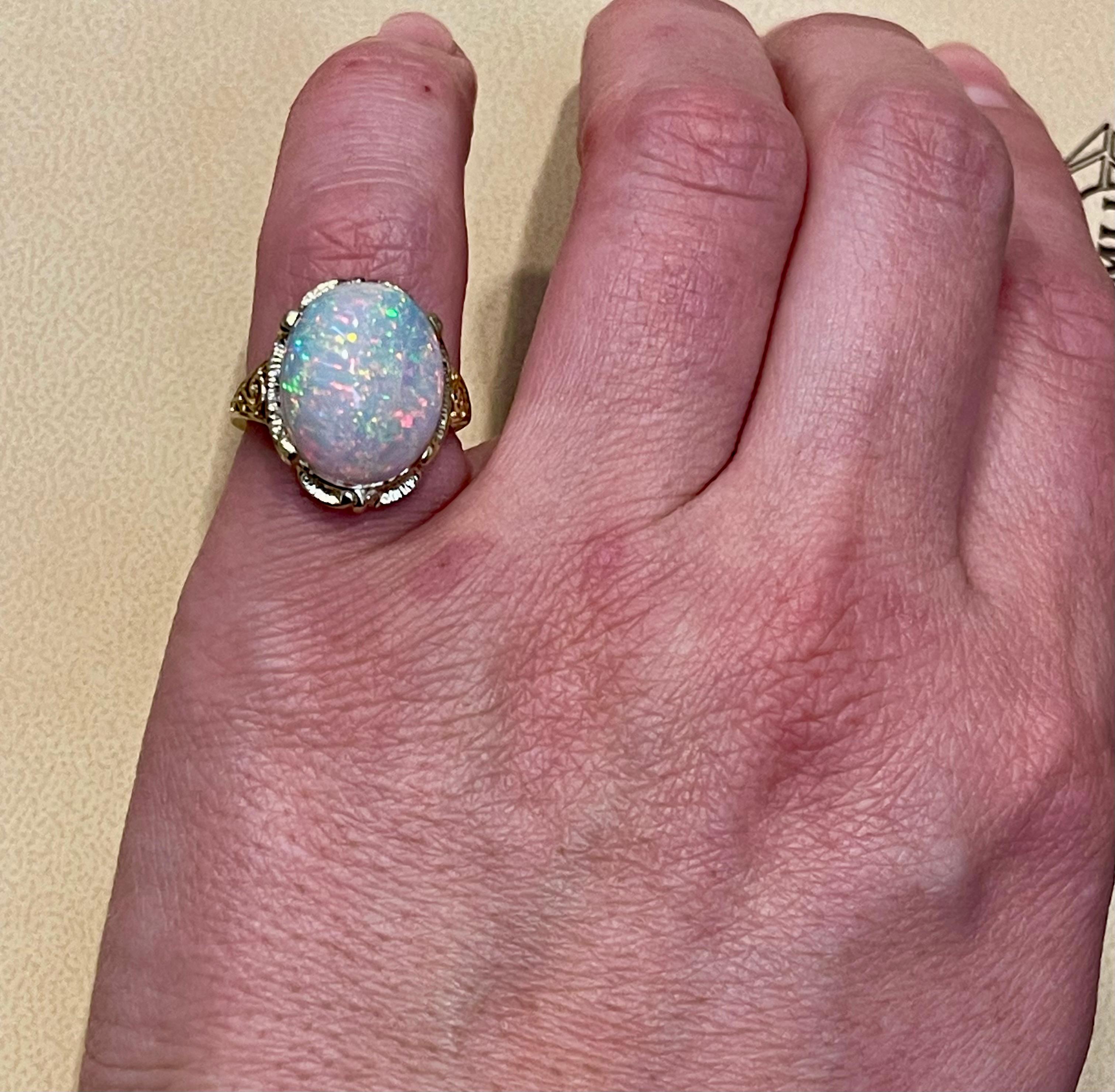 9 Carat Oval Shape Ethiopian Opal Cocktail Ring 14 Karat Yellow Gold In Excellent Condition For Sale In New York, NY