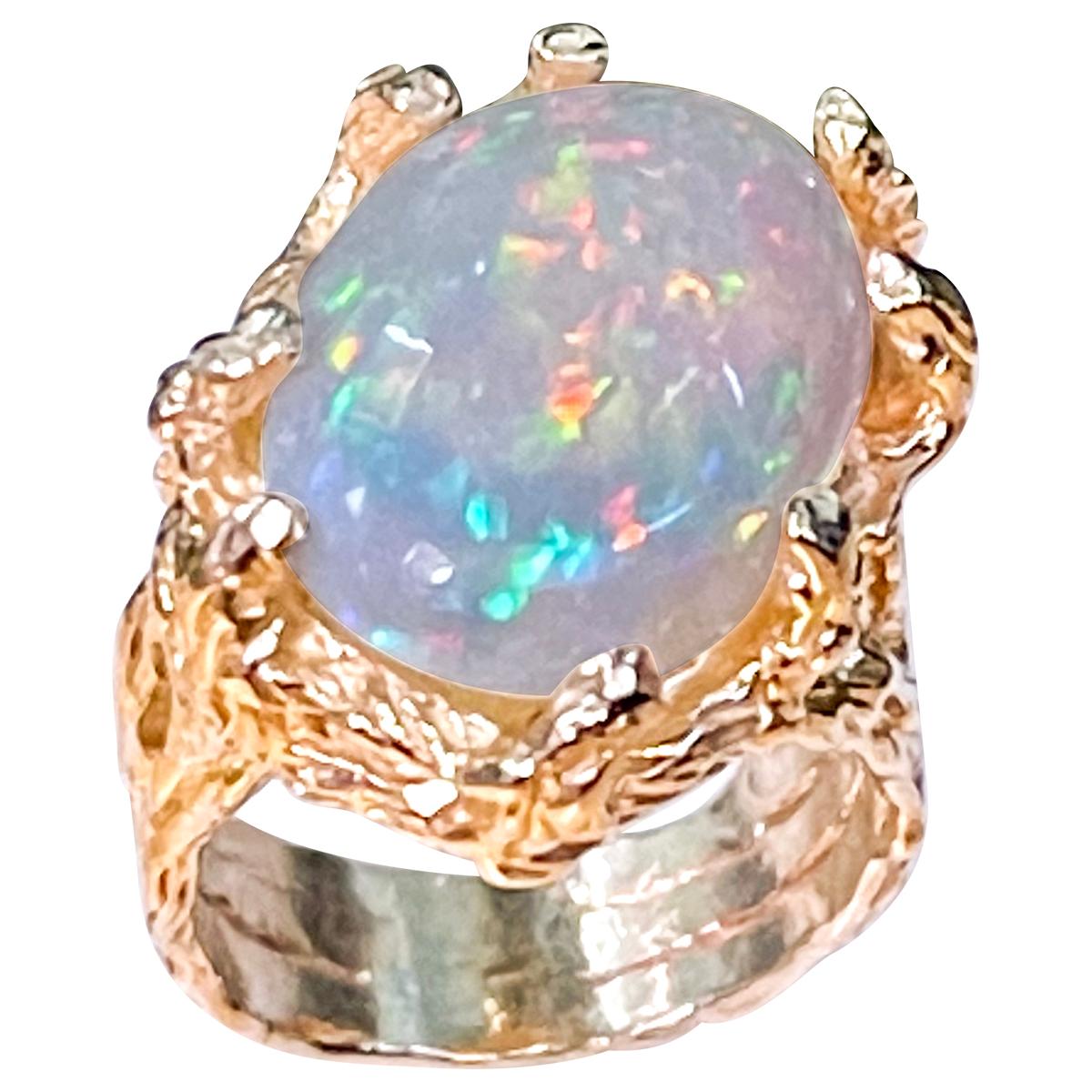9 Carat Oval Shape Ethiopian Opal Cocktail Ring 14 Karat Yellow Gold size 6
Oval  Natural Opal  A classic, Cocktail ring 
14 Karat Yellow Gold Estate
Size of the opal 17 X 13 MM, Approximately 9 Ct
Amazing colors in this opal and a great quality