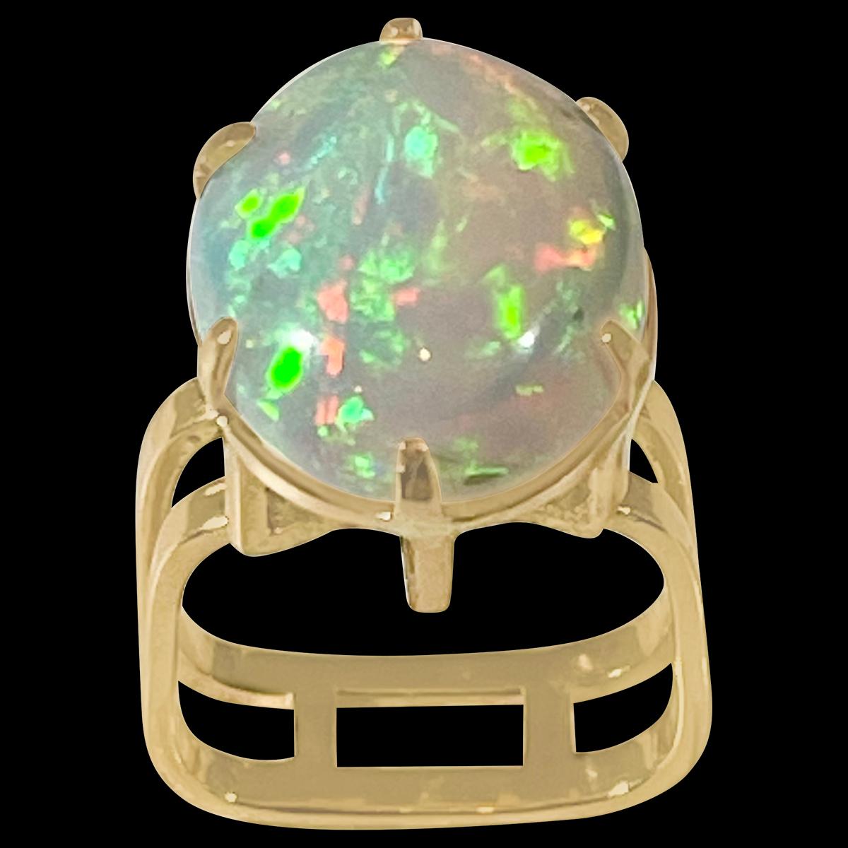 approximately 12 Carat Oval Shape Ethiopian Opal Cocktail Ring 14 Karat Yellow Gold size 6.5
Oval  Natural Opal  A classic, Cocktail ring 
14 Karat Yellow Gold Estate
Size of the opal 18 X 15 MM, Approximately 12 Ct
Amazing colors in this opal and a