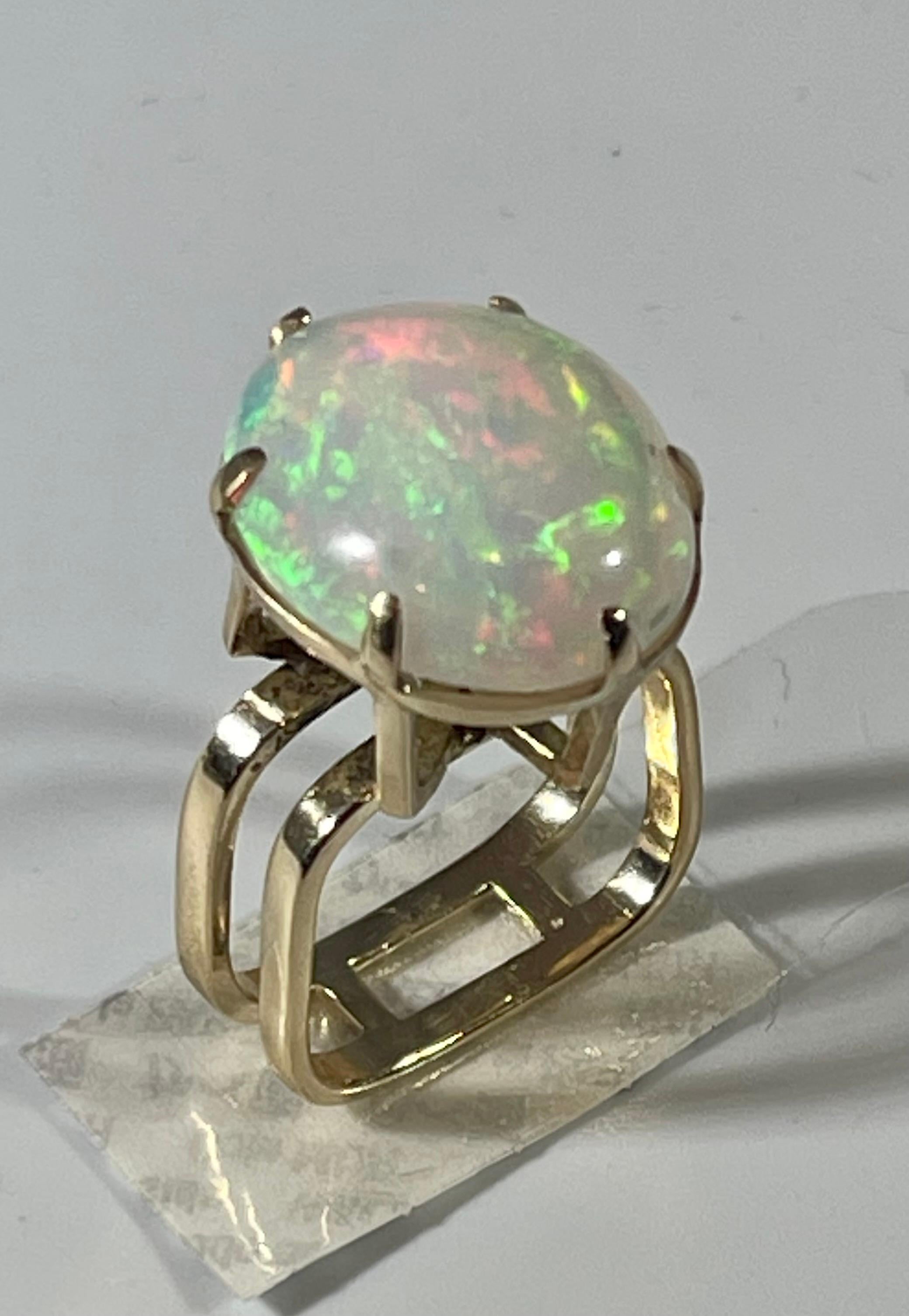 Oval Cut 12 Carat Oval Shape Ethiopian Opal Cocktail Ring 14 Karat Yellow Gold For Sale