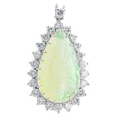 9 Carat Pear Cut Opal and Diamond Pendant Set in 12 Karat White Gold