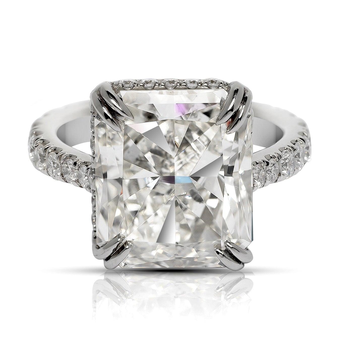 CLAIRE DIAMOND ENGAGEMENT PLATINUM RING BY MIKE NEKTA
 
GIA CERTIFIED
Center Diamond:
Carat Weight: 7 Carats
Color: K
Clarity: SI1
Style:  CUT-CORNERED RECTANGULAR MODIFIED BRILLIANT
Aproximate Measurements: 12.4 x 10.6 x 6.5 mm

Ring:
Metal: