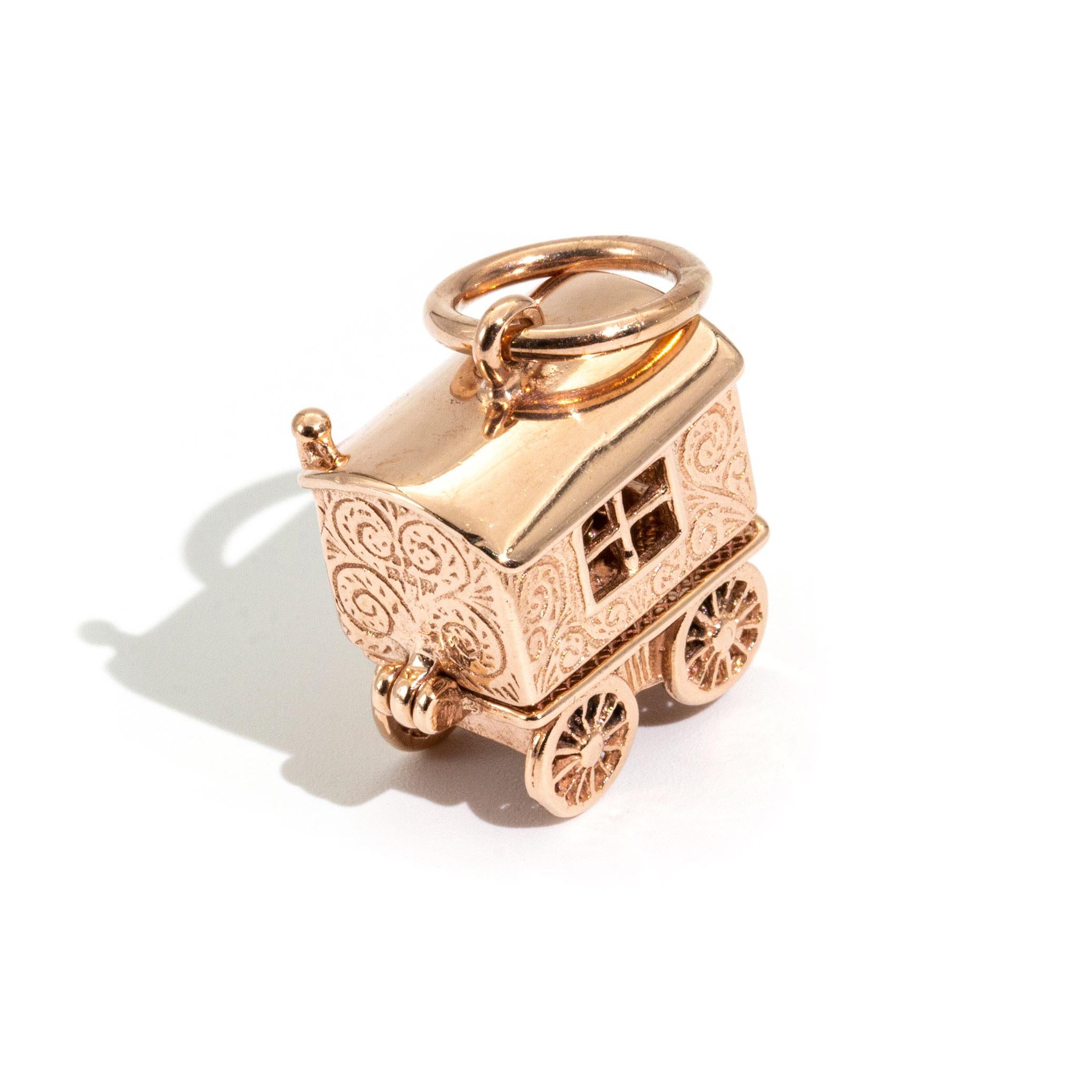 Crafted in 9 carat rose gold is this darling, hard to find, intricately designed vintage charm featuring a Gypsy carriage with a hinged top section that open up to reveal a clairvoyant  a sitting at a table looking into a crystal ball. This charm is