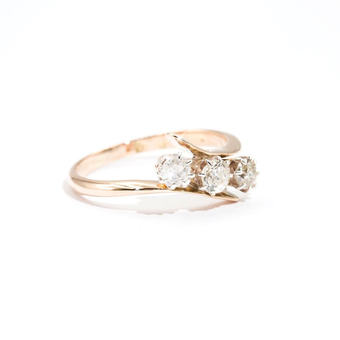 Carefully crafted in 9 carat rose gold is this crossover 3 stone vintage ring featuring three charming old cut diamonds. We have named this darling vintage ring The Edith Ring. The Edith Ring invokes romance and nostalgia, and would make a charming