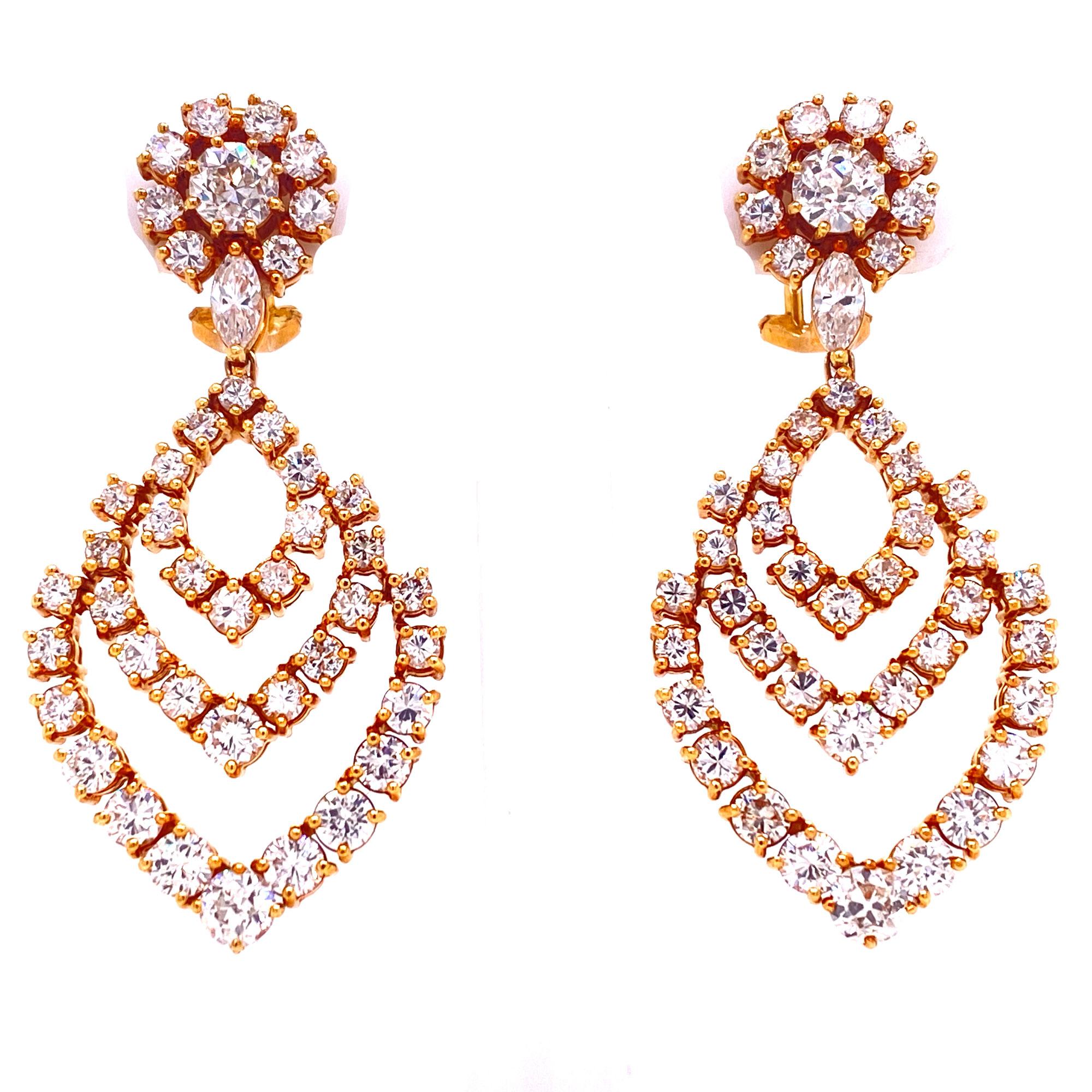 Stunning diamond drop earrings fashioned in 18 karat yellow gold. The earrings feature 88 round brilliant cut diamonds weighing approximately 9.00 carat total weight. The diamonds are graded F-G color and VS2-SI1 clarity. The earrings measure 2.0