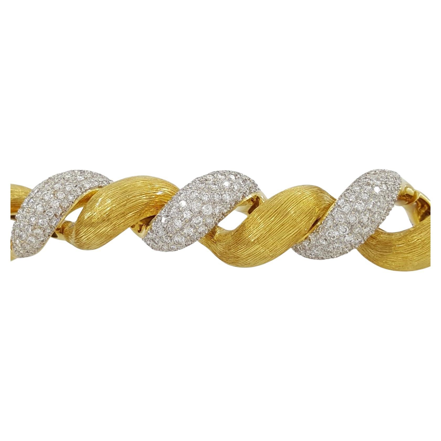 9 ct total weight Round Diamond Cuff Bangle Bracelet. 

The bracelet weighs 67.8 grams, 6.8 inches long (fits medium size wrist), contains 664 Natural Round Brilliant Cut Diamonds weighing approximately 9 ct total weight, G-H in Color, VS-SI in