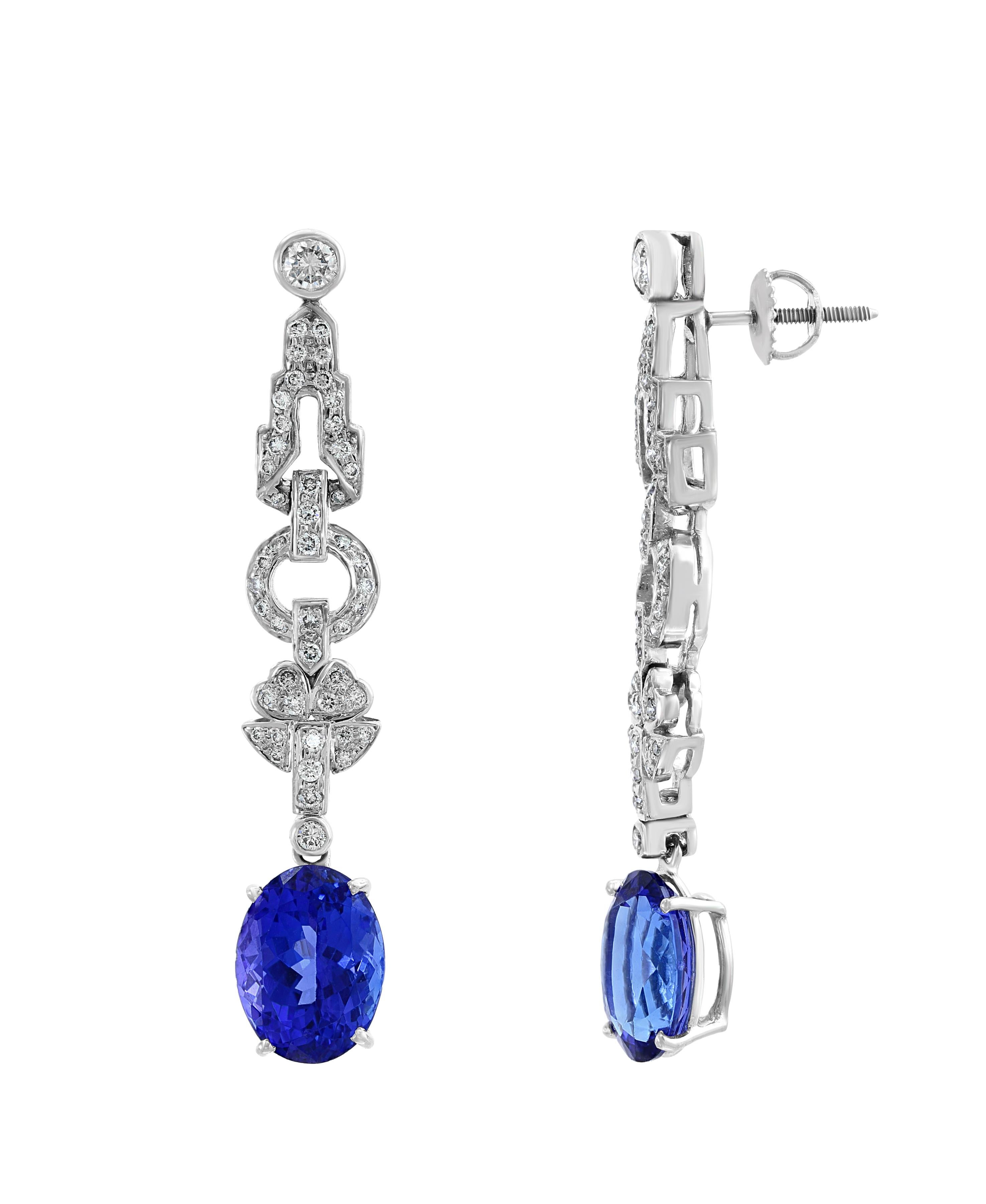 9  Carat  Oval  Tanzanite and Diamond Hanging or Cocktail Earring 14 Karat White Gold
perfect pair made in  14 carat White gold . 
14 K gold : 13 Grams
 Diamonds: approximate 1.8 carats
Tanzanite:  9 Carats
Its very hard to capture the true color