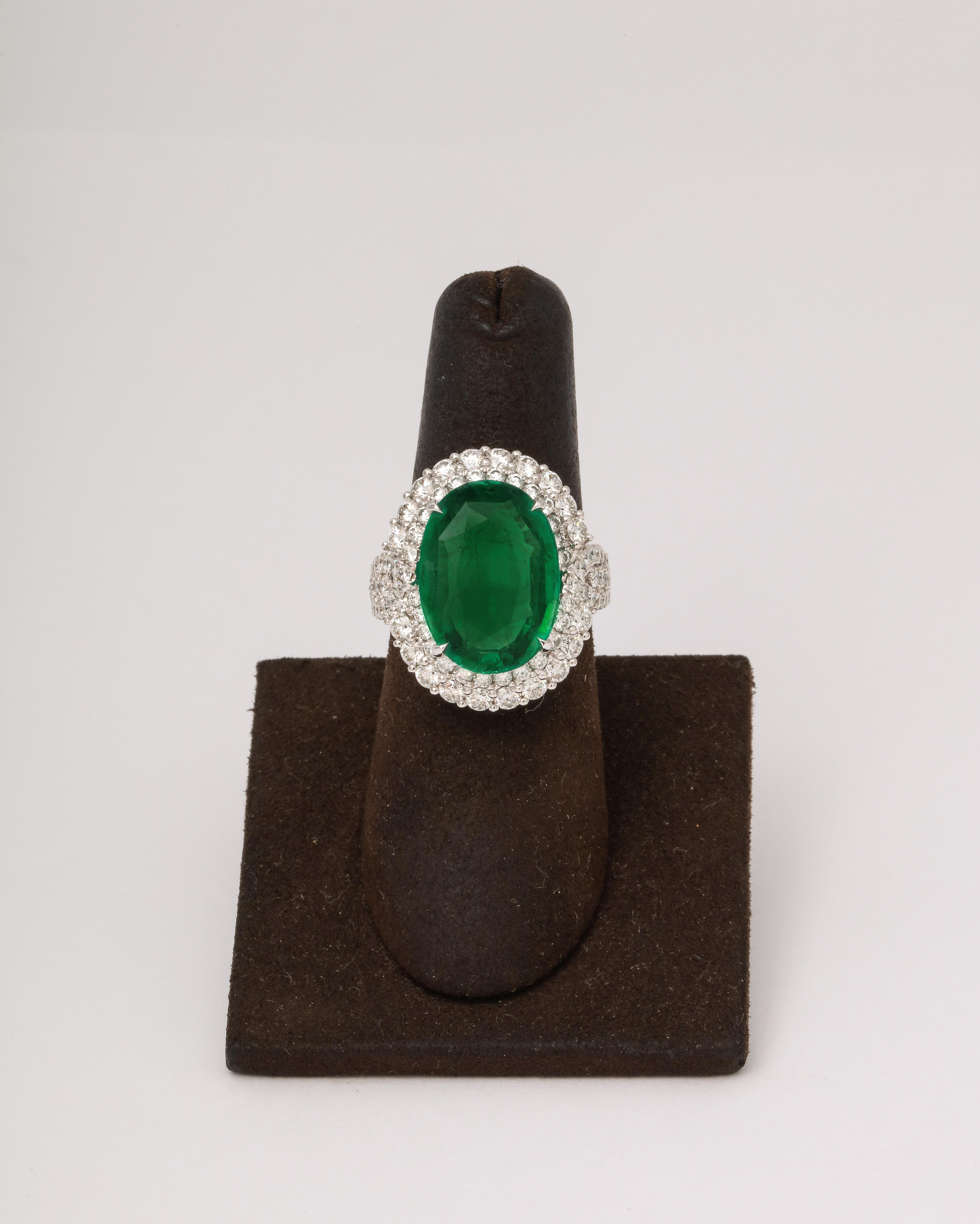
A FABULOUS ring! 

9.53 carat Vivid Green Oval shaped emerald. 

2.13 carats of round brilliant cut diamonds. 

Set in 18k white gold 

Currently a size 6.5, this ring can be sized to any finger size. 

Exceptional color - pictures do not do this