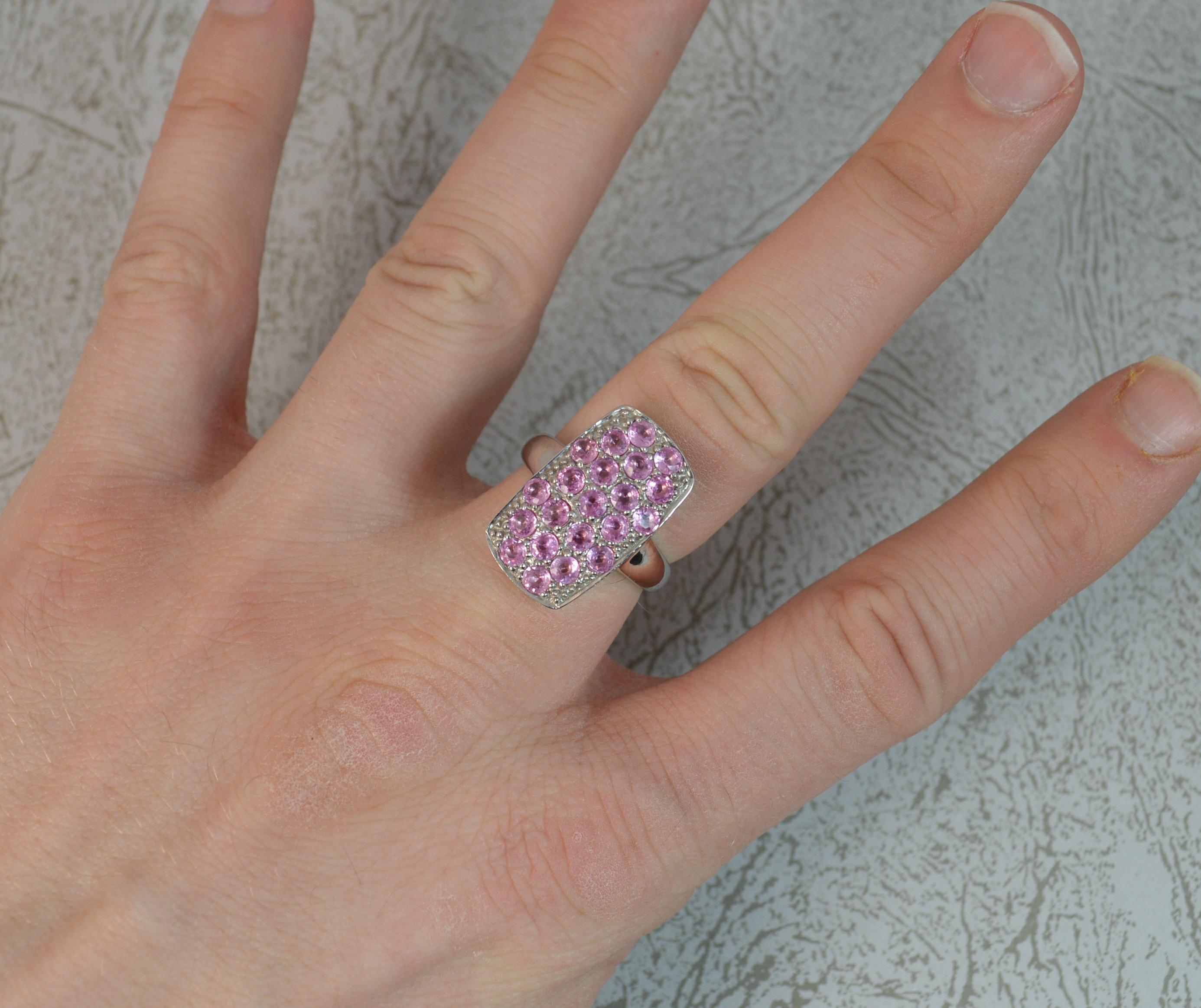 A stylish 9 carat white gold, pink sapphire and diamond ring.
Large rectangular cluster head with pierced sides.
12mm x 21mm cluster head.
Condition ; Excellent. Clean, solid shank. Well set stones. Please view photographs.
Size ; N 1/2 UK, 7