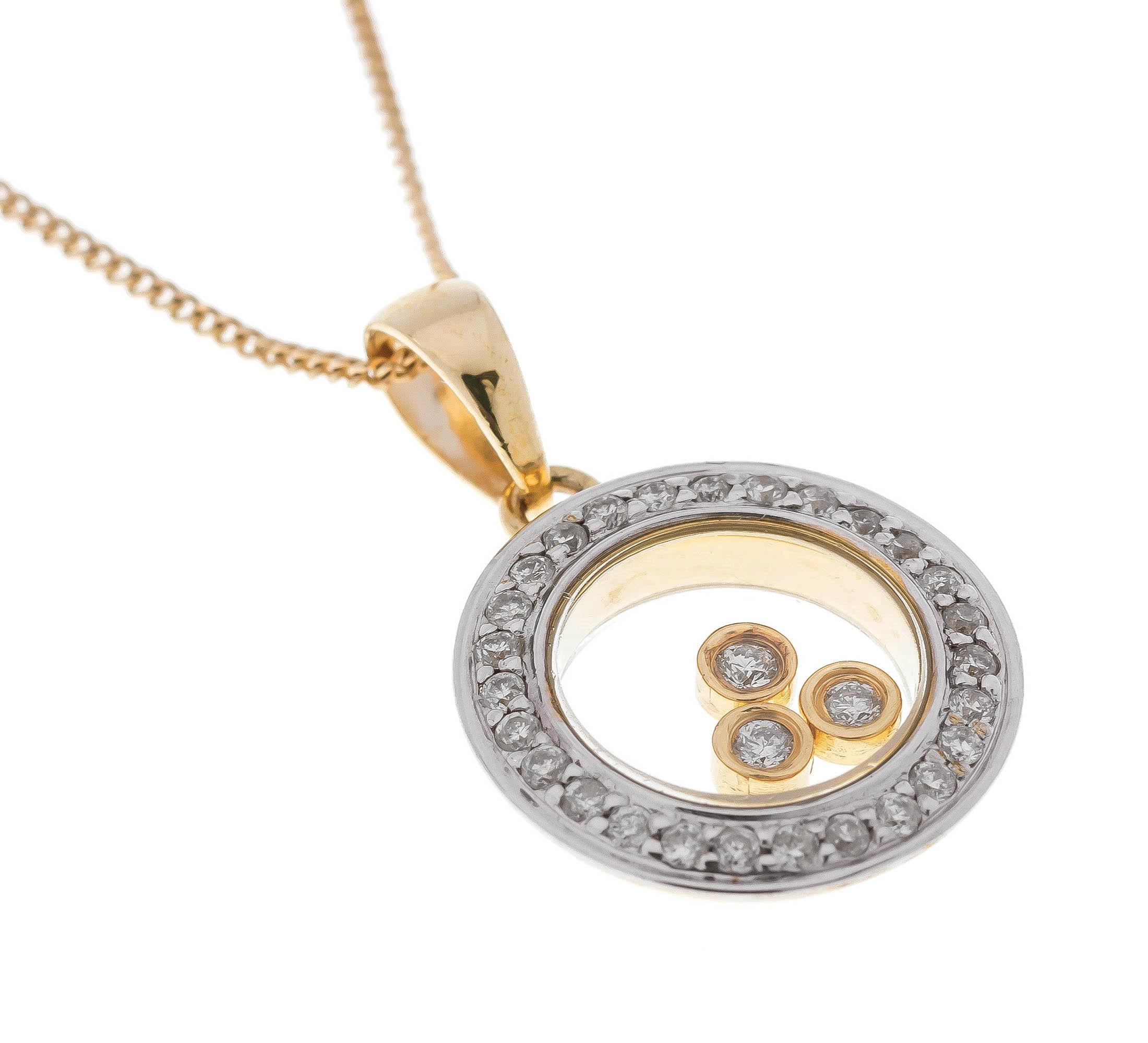 This gorgeous pendant, designed as a white gold diamond circle, surrounding three floating diamonds, each set in a yellow gold collet.

A fun and playful pendant, that can be worn day or night. a gorgeous gift for Christmas.

SPECIFICATION
Weight