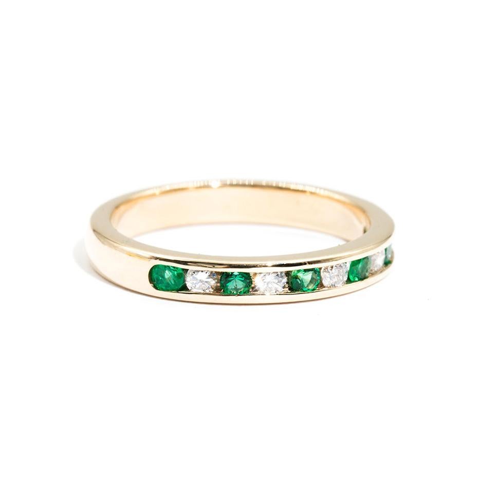 Forged in 9 carat yellow gold is this darling vintage ring featuring a charming row of sparkling round white diamonds and gorgeous round green emeralds. We have named this vintage splendour The Roberta Ring. The Roberta Ring is perfect on her own,