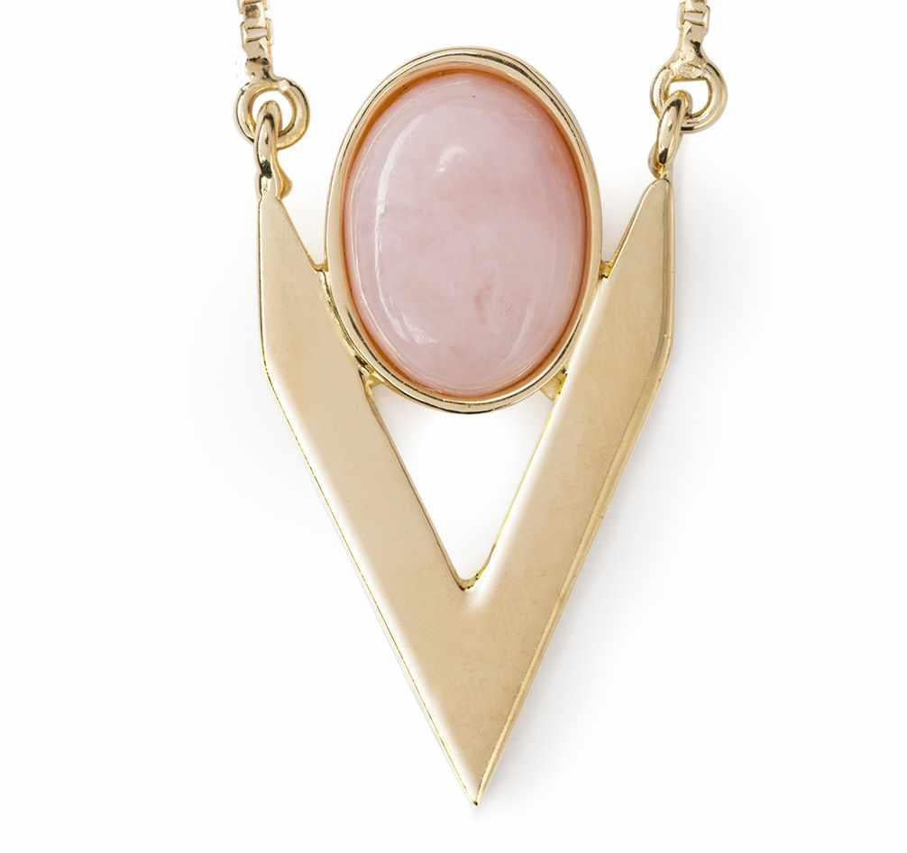 Iosselliani jewellery pieces are intended to be the new classic with an edgy style. Designed with a 9 Karat gold chain, the necklace features a pink opal cabochon framed into a V shape for an edgy yet feminine aesthetic. Bringing geometry to your