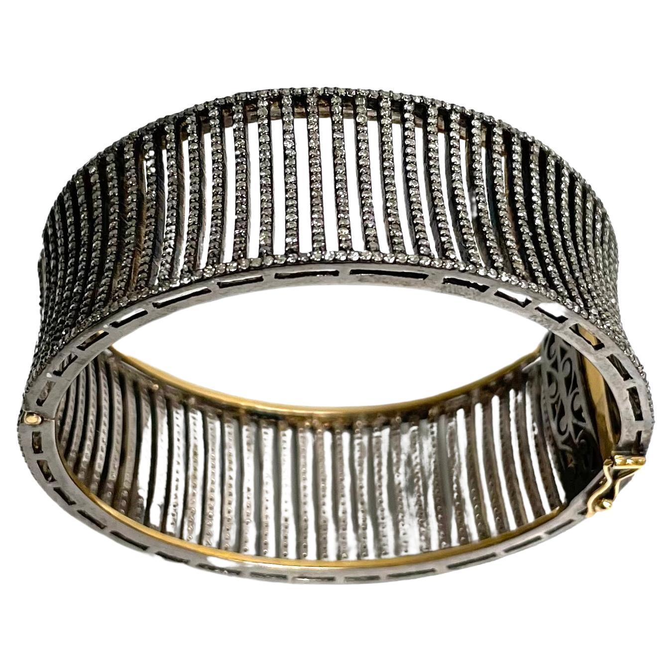 Description 
This statement diamond cuff bracelet boasts an edgy and sophisticated style perfect for any fashion icon who wants to make heads turn twice. The beautiful pave diamond concave bars gives this stunning bracelet its rightful place as the