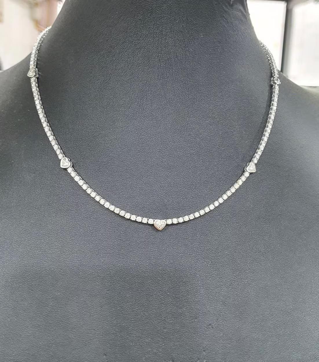 Modern 9 Ct Tennis Necklace with 5 heart shaped diamonds set in bezel in 14k Gold. For Sale