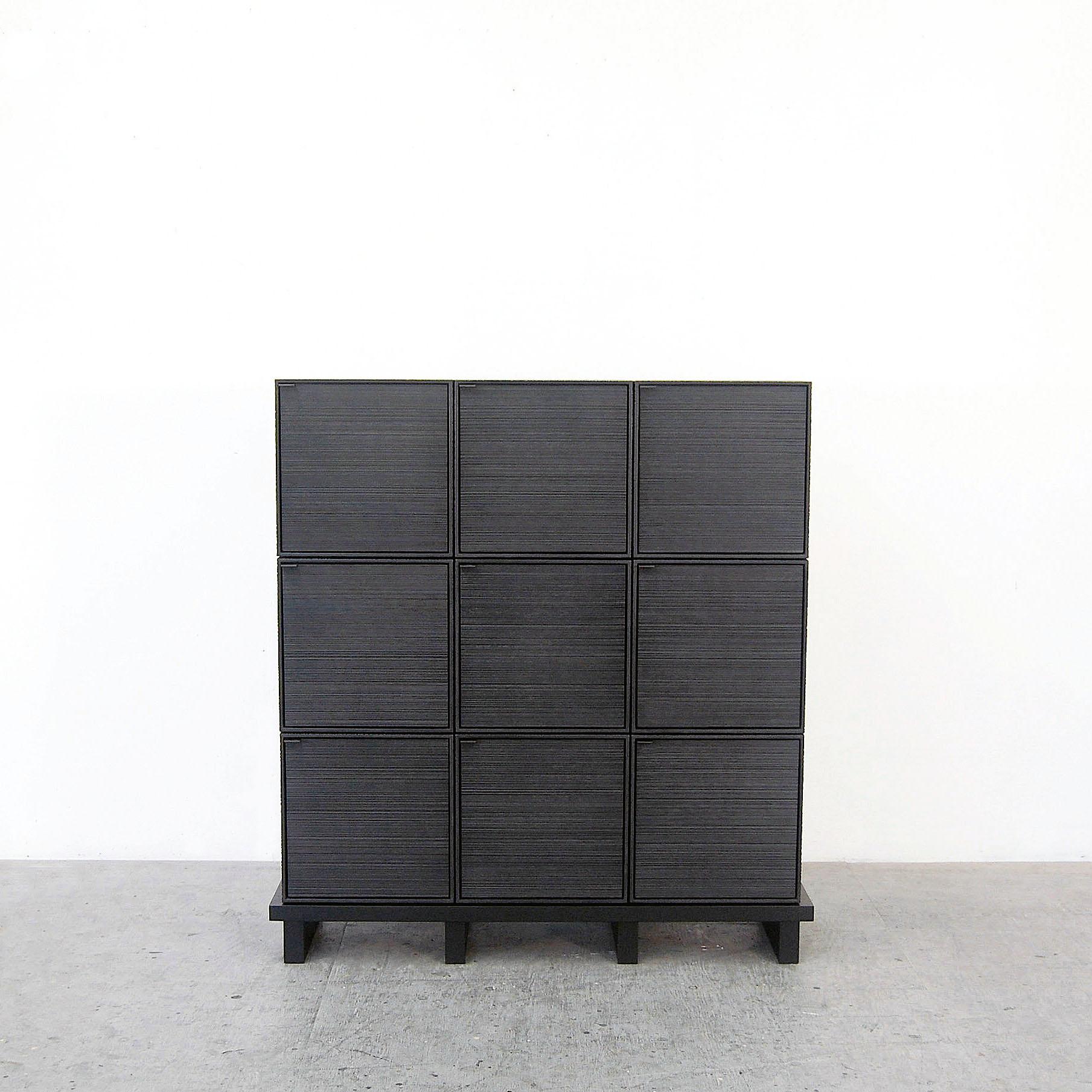 9 Cubes Cabinet by John Eric Byers
Dimensions: D115 x W38 x H115 cm
Materials: sawn + blackened + maple + ash

All works are individually handmade to order.

John Eric Byers creates geometrically inspired pieces that are minimal, emotional, and