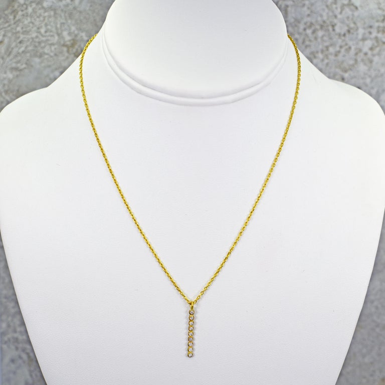 Contemporary 9 Diamond 22 Karat Gold Bar Pendant Necklace For Sale