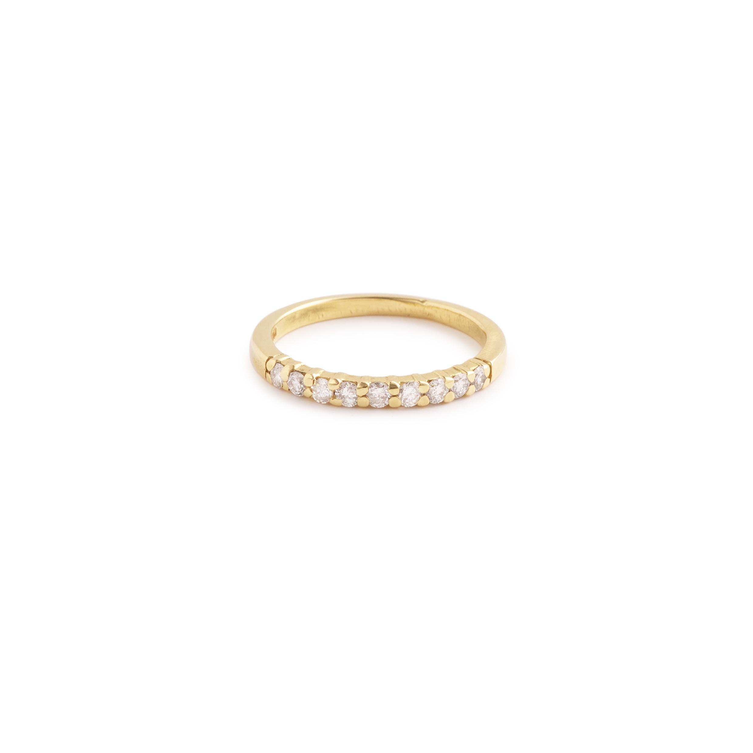 Yellow gold wedding band set with 9 small brilliant cut diamonds.

Total weight of diamonds: 0.10 carats

Dimensions : 2.45 mm (0.096 inch)

Finger size: 55 (US size: 7 1/4)

18 karat yellow gold, 750/1000th
