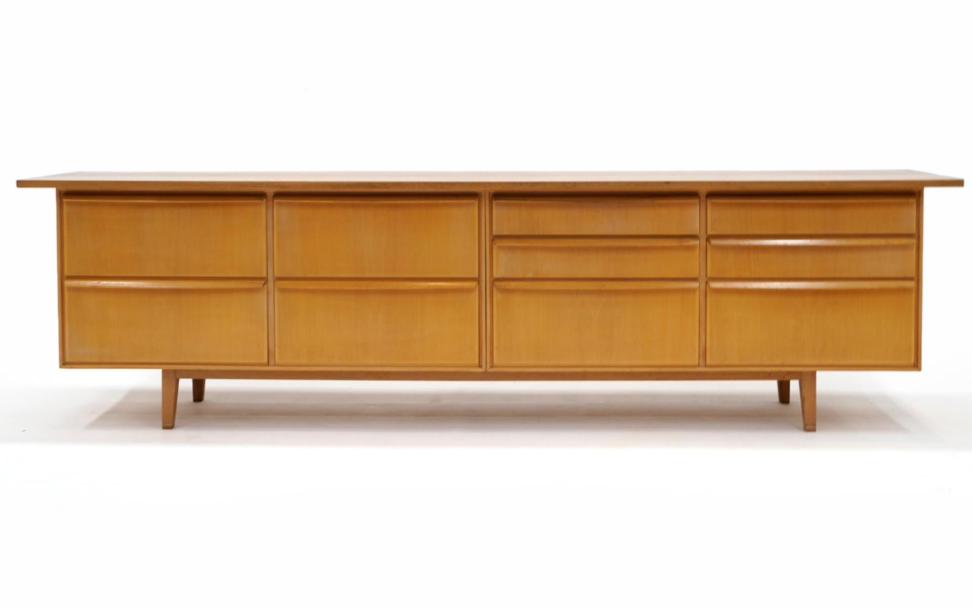 Blond solid birch credenza / storage cabinet in solid birch. Unique design with drawers and drop down doors. The original owners purchased this new in Germany in the 1960s. We don't know the maker but the build is of the highest quality. The front