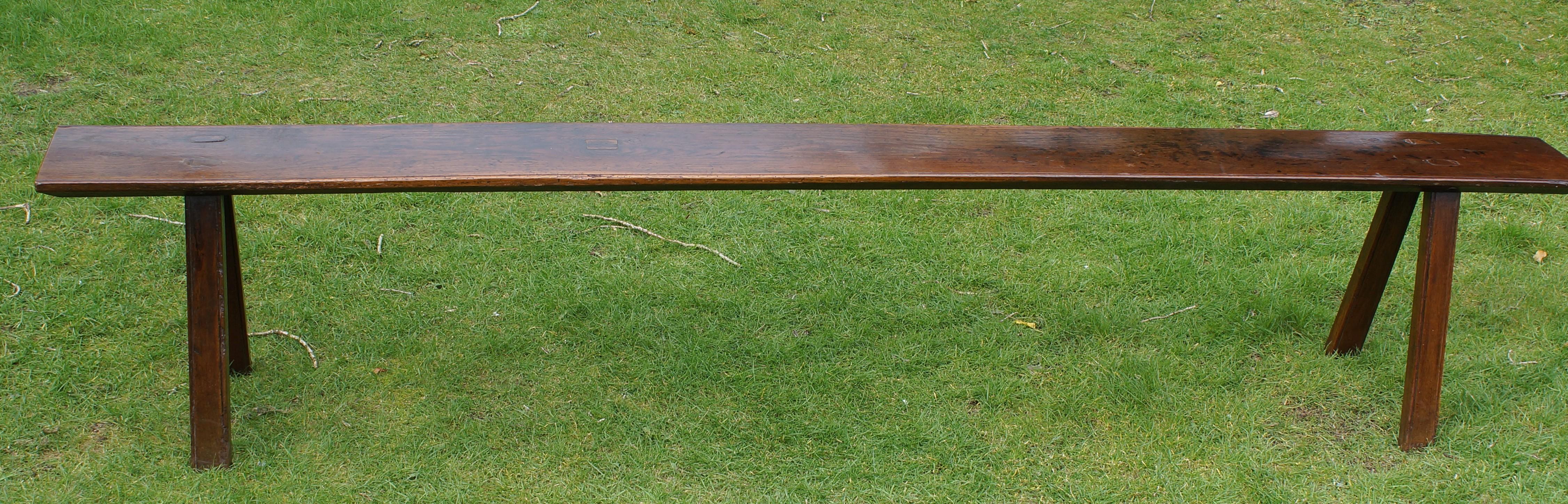 A wonderful bench with a good original finish and rich patina. Having a thick single piece top and four tapered legs.
A good solid bench with a seat width of 25 cm.
Wales 18th century.
This bench would work really well in a long hallway with coats