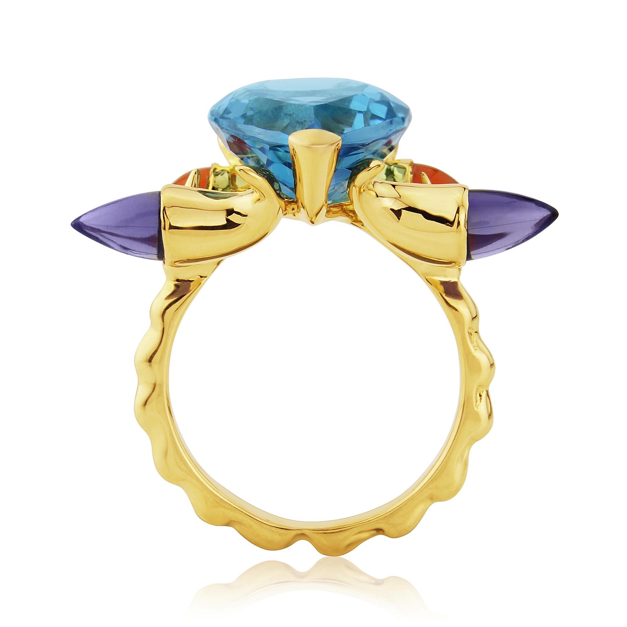 This modern handmade British-London Hallmarked 9 karat yellow gold ring, set with swiss blue natural topaz, carnelian and iolite is from MAIKO NAGAYAMA's one of the Pret-a-porter Collection called 