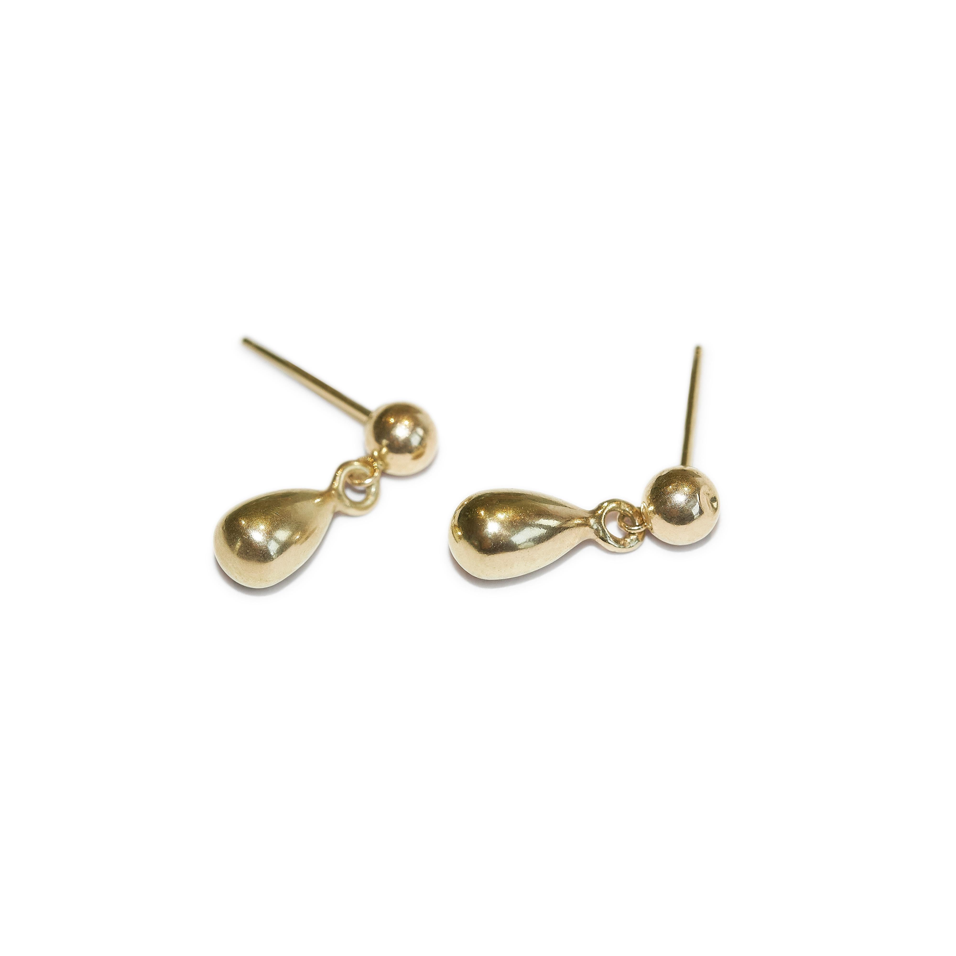 A pair of small stud earrings featuring a solid 9kt gold teardrop charm. 

Handmade to order from Skomer Studio's workshop in North London in recycled 9kt gold.

Details:
Colour: Gold
Composition: 9kt gold
Country of origin: United Kingdom
9kt gold