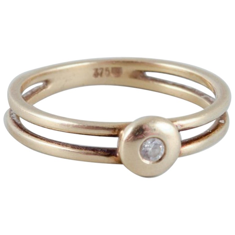 9-karat gold ring with a small diamond in modernist design. Mid-20th C.
